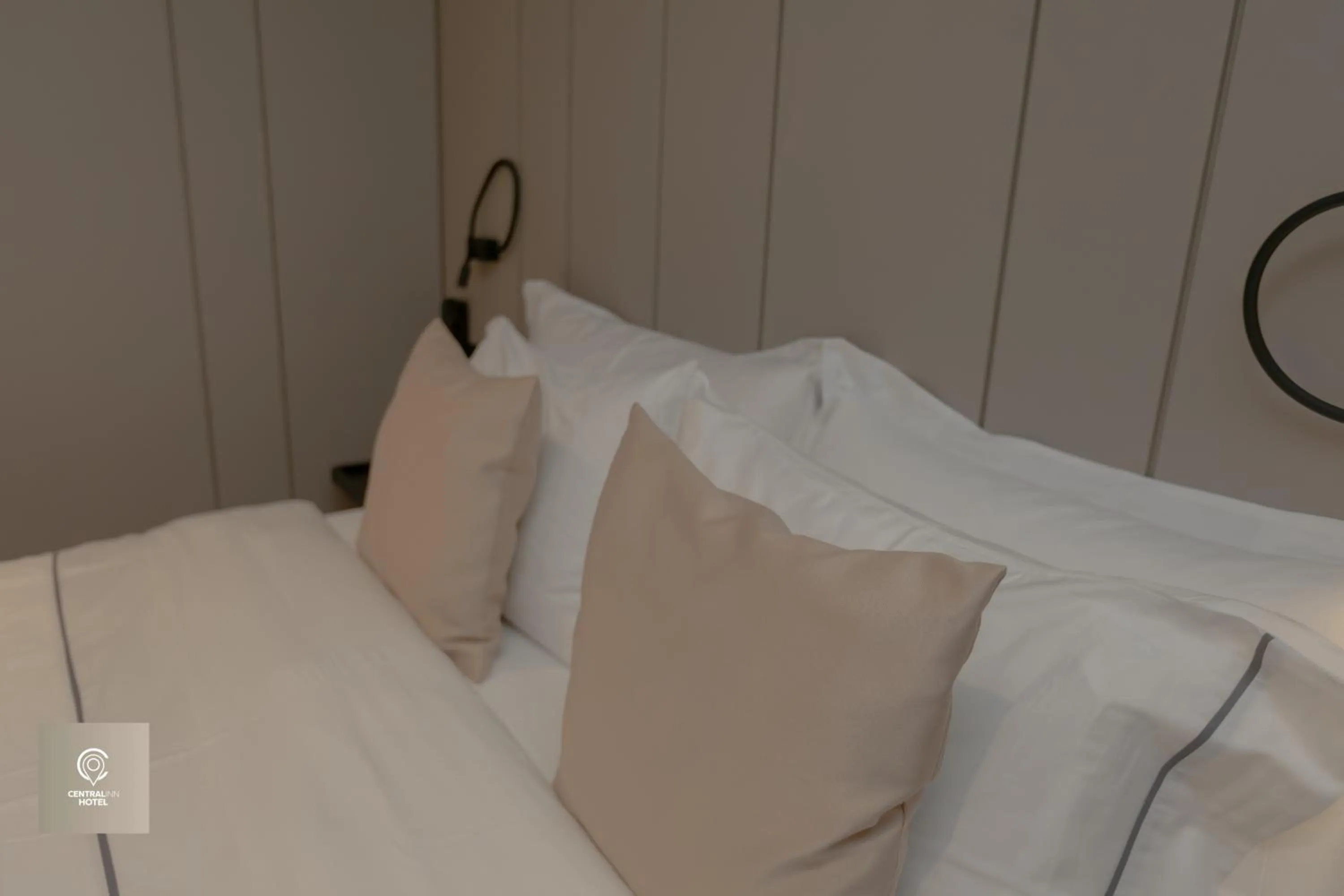 Bed in Central Inn Hotel