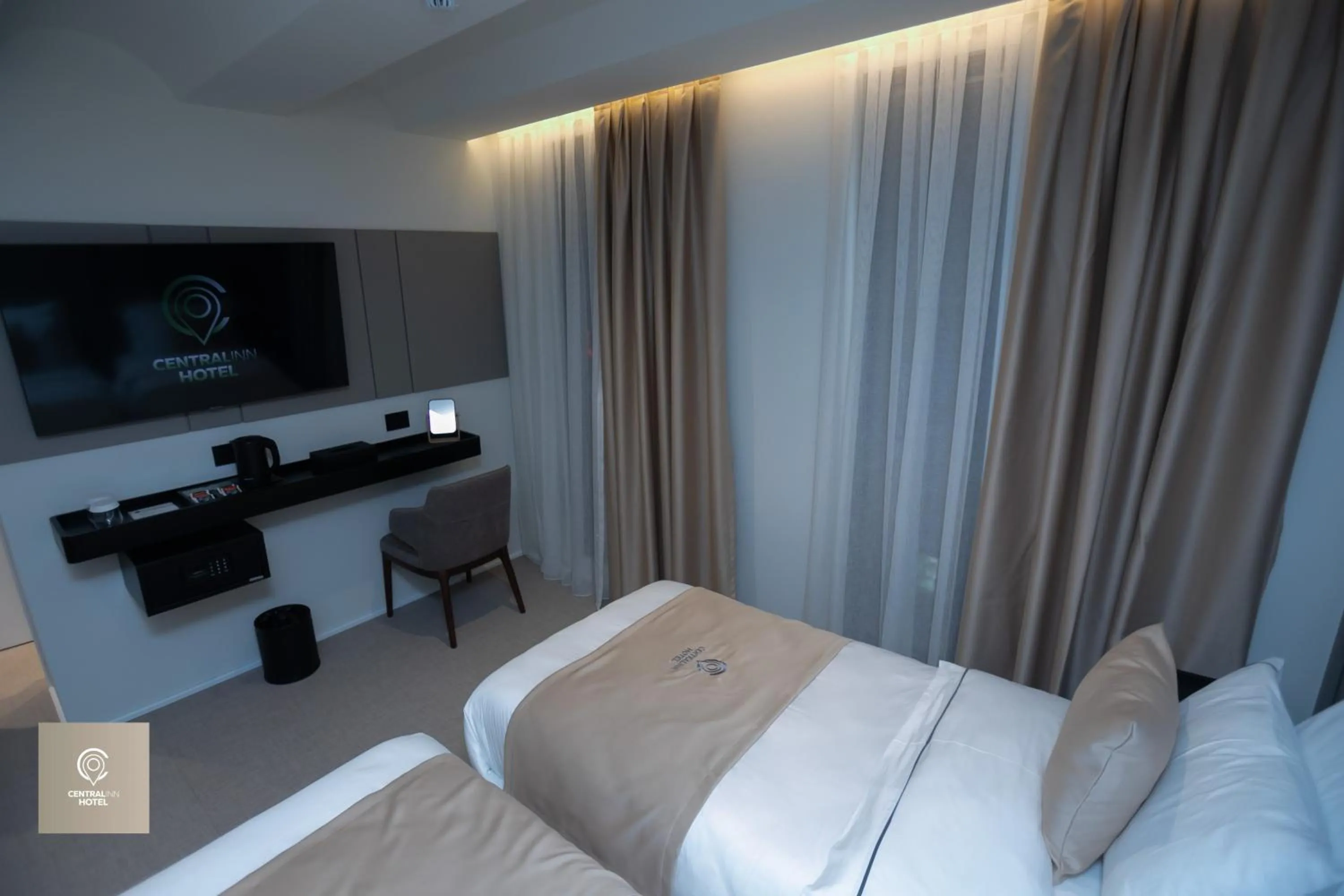 Bed in Central Inn Hotel