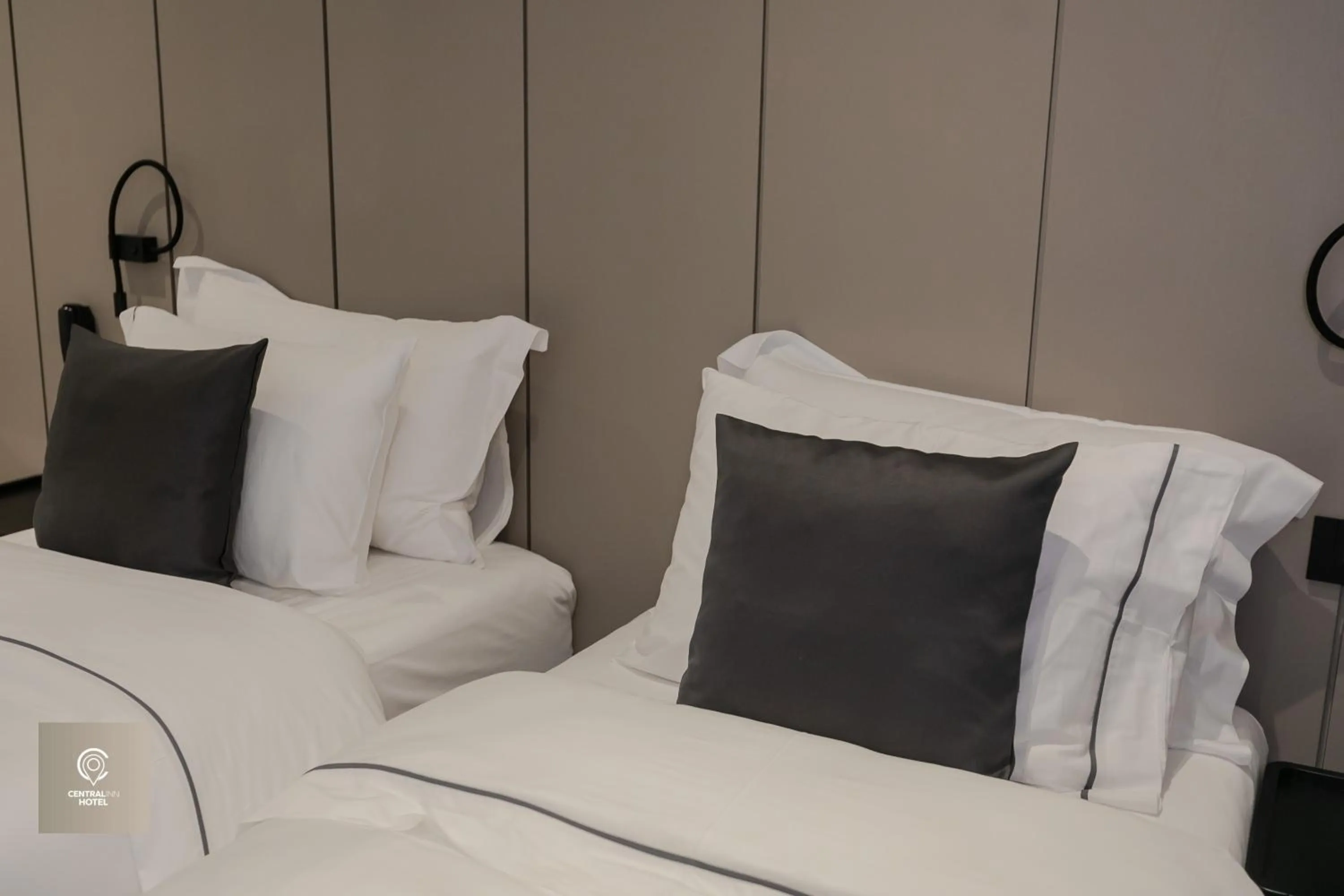 Bed in Central Inn Hotel