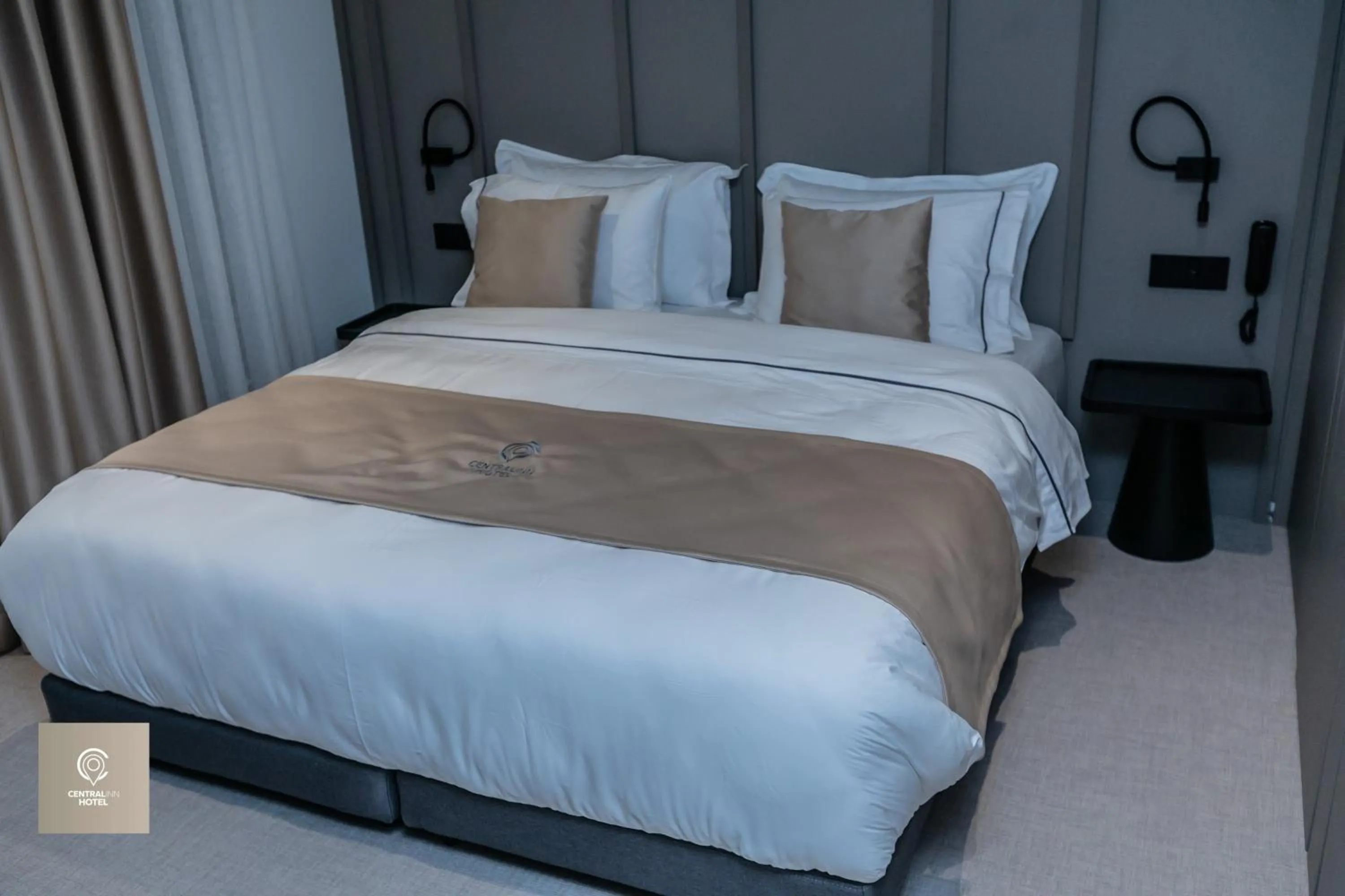 Bed in Central Inn Hotel