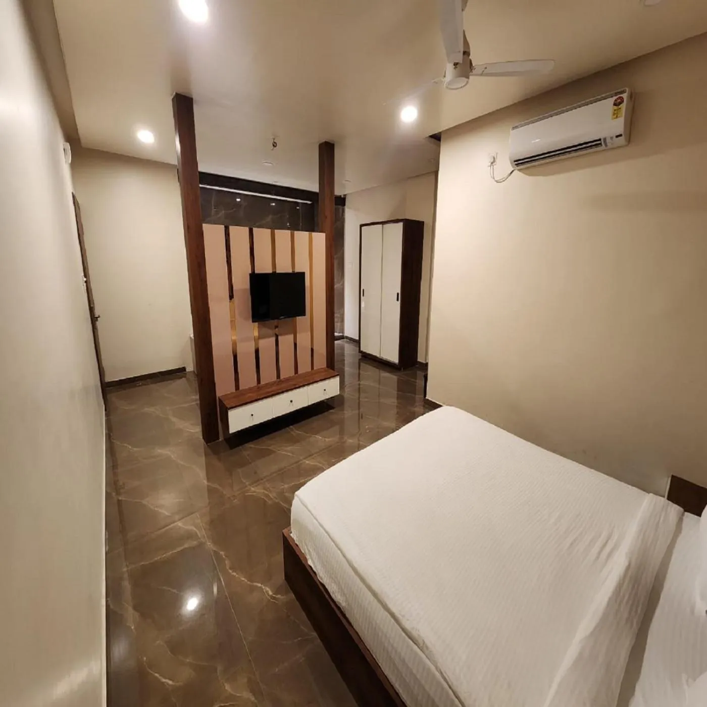 Photo of the whole room, Bed in Hotel The Mint Nanded