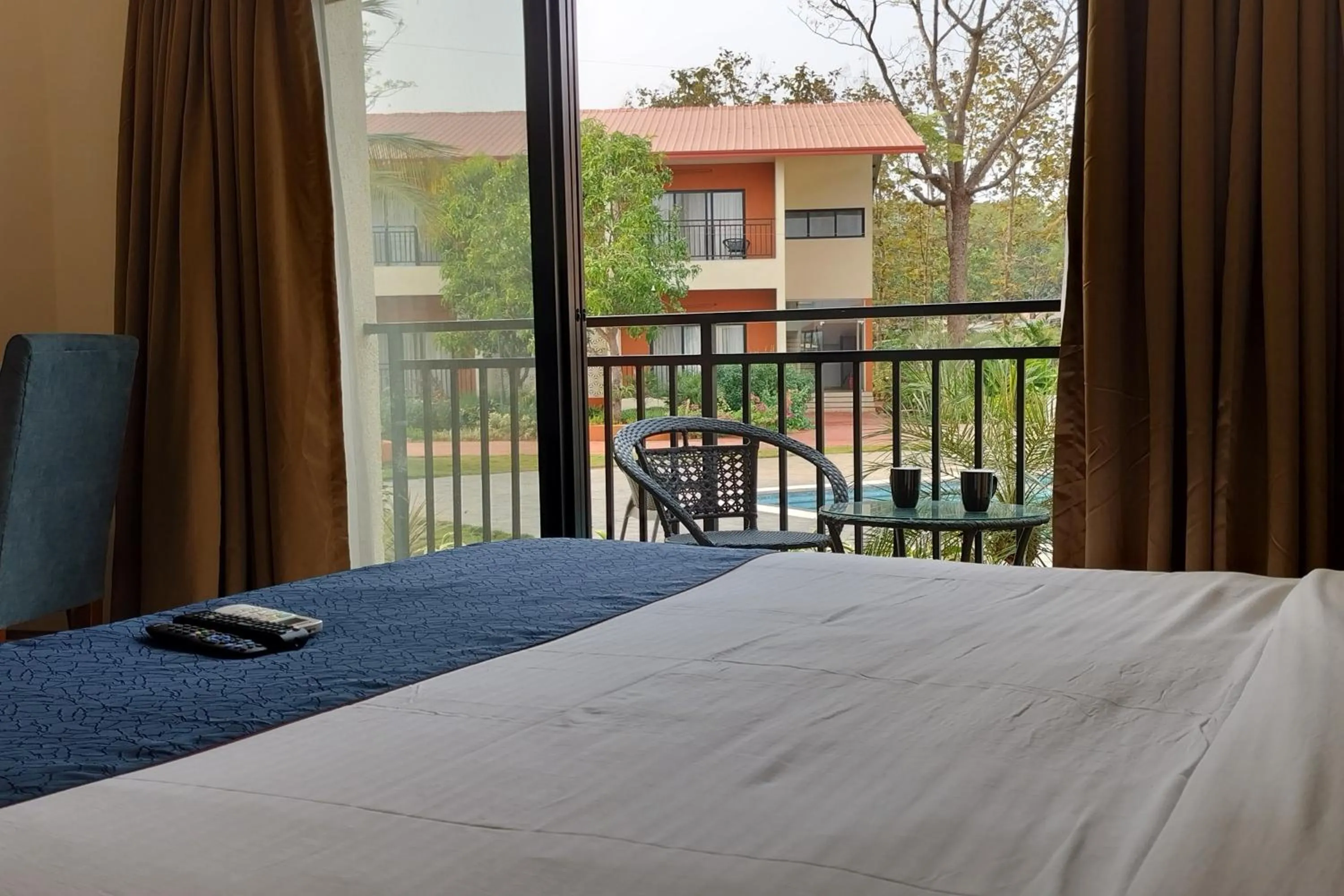 Balcony/Terrace, Bed in Pegasus Lifestyle Resort Karjat
