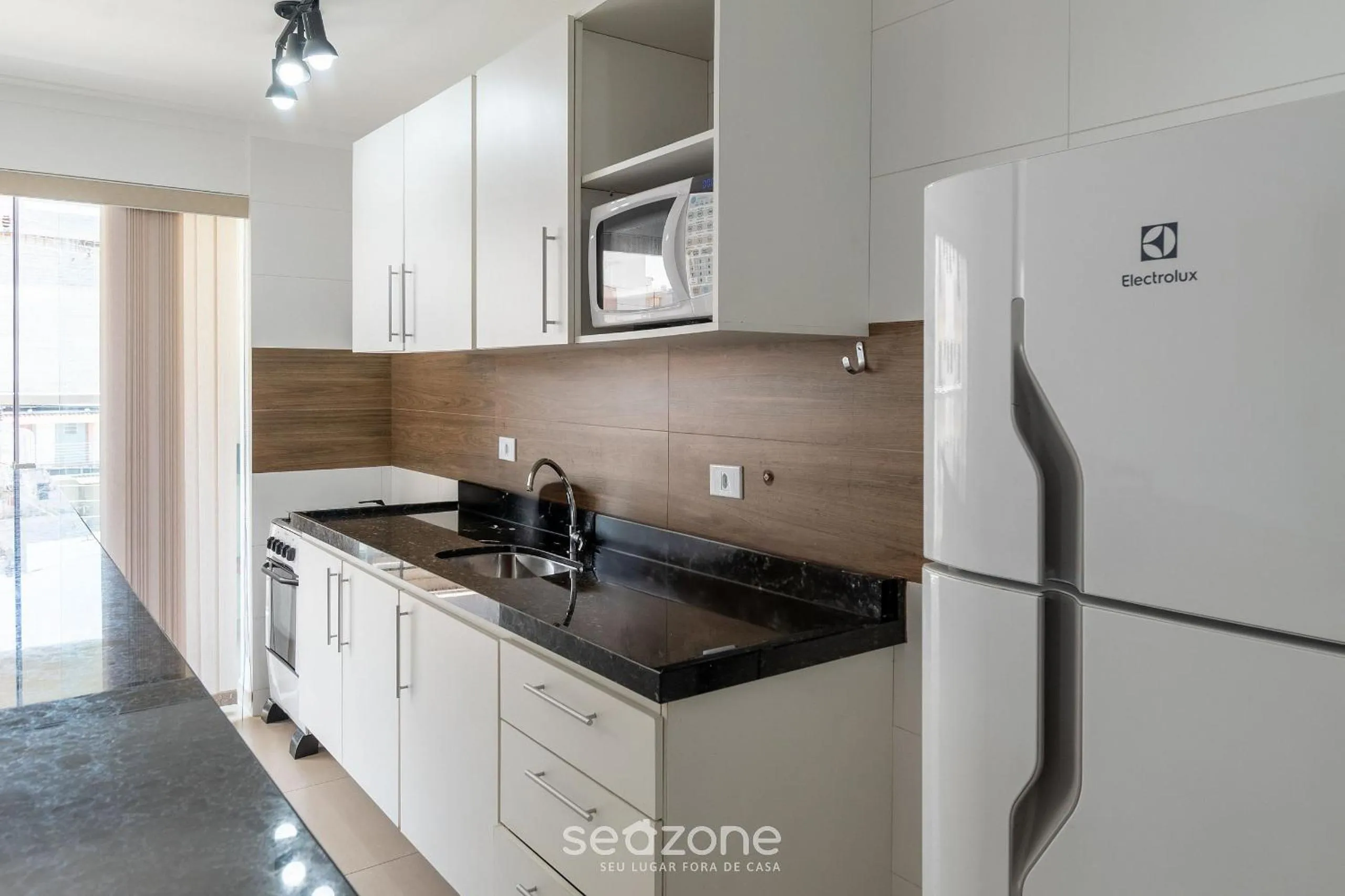 Kitchen or kitchenette in RJI - Apartamentos próximos da praia de Itaguá