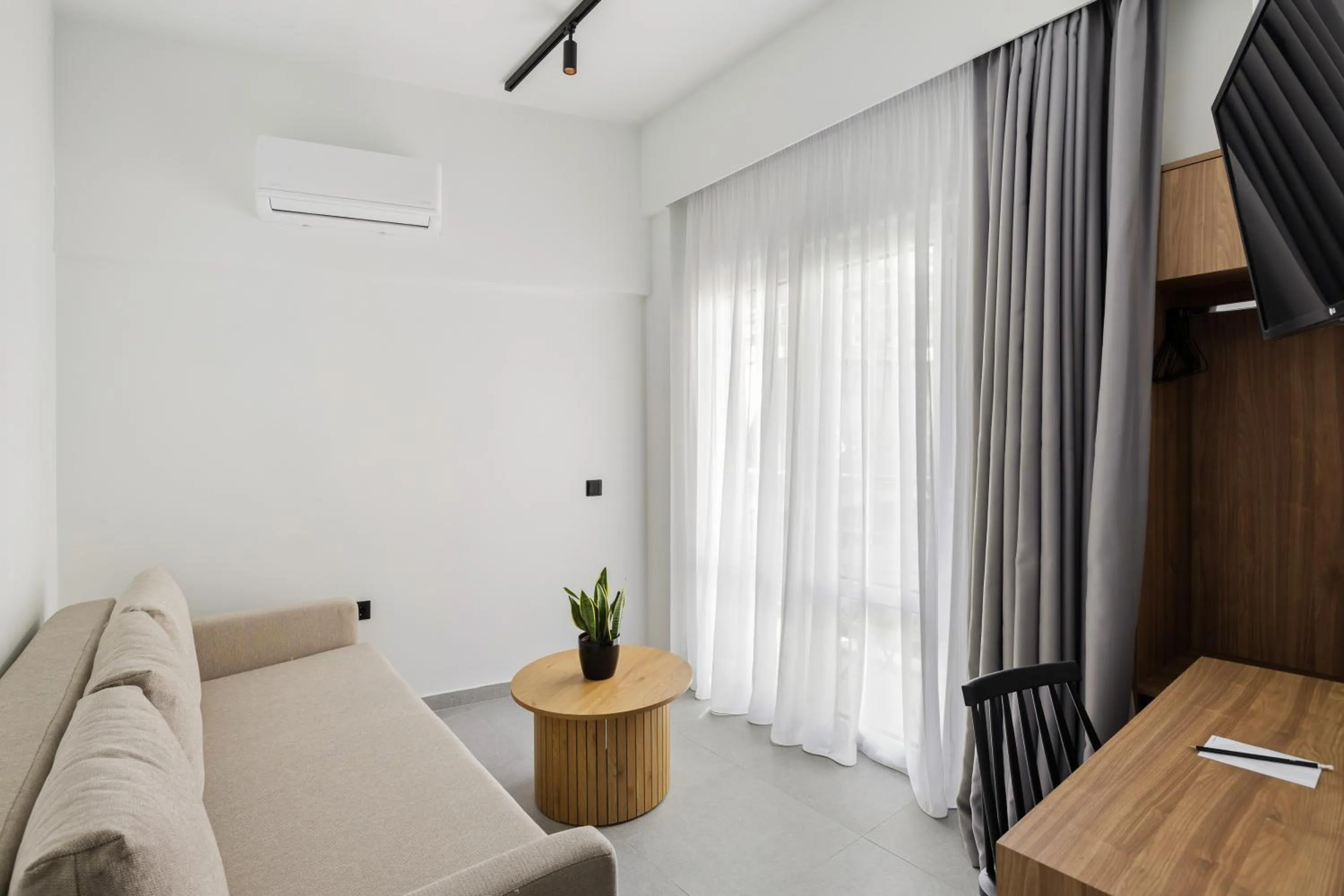 Communal lounge/ TV room in The Q Hotel