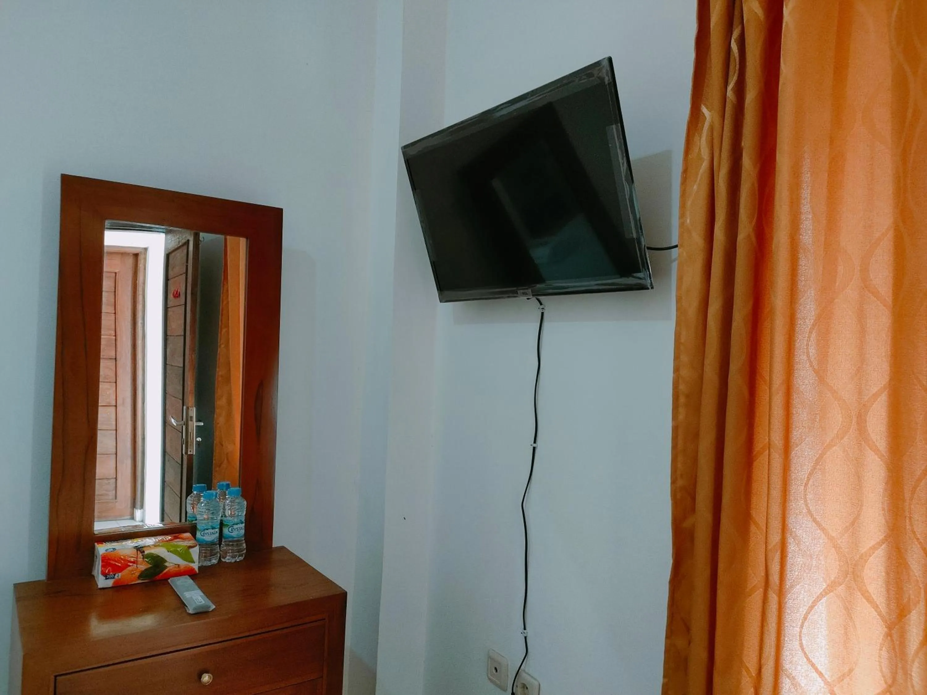 TV and multimedia in RedDoorz Syariah near Jogja Expo Center