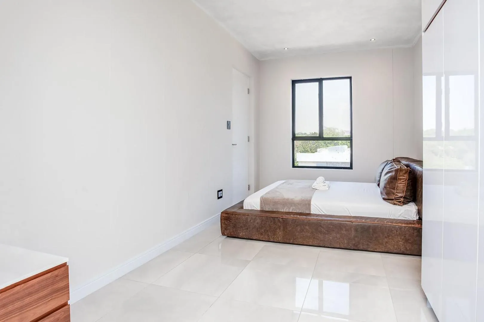 Bed in Urban Oasis Apartments at The Paramount