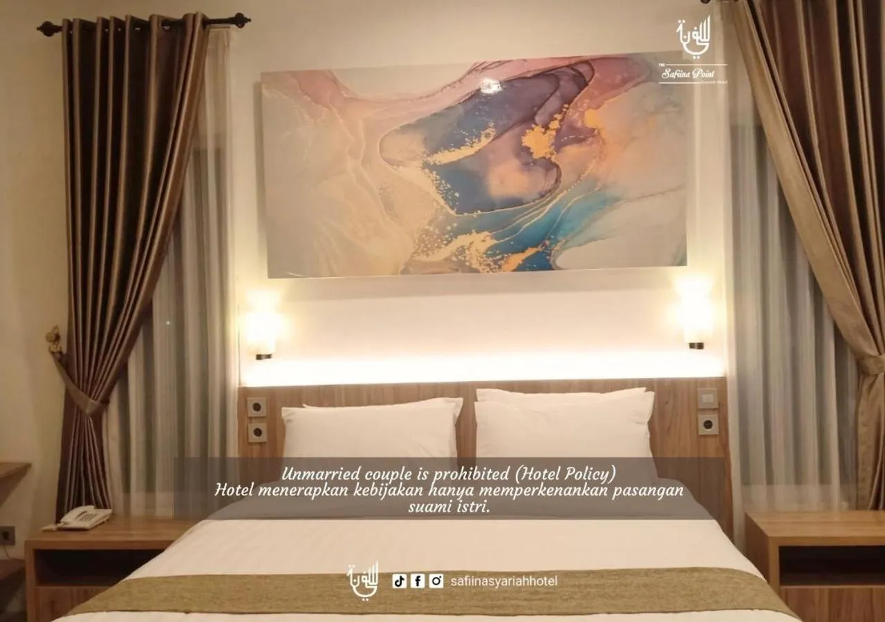 Bed in The Safiina Point Syariah Hotel