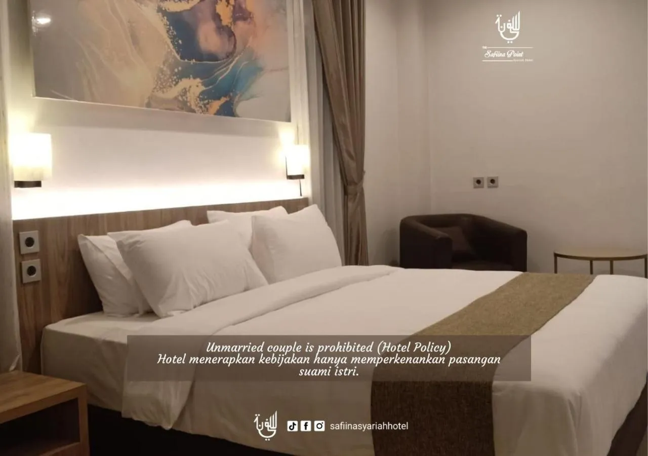 Bed in The Safiina Point Syariah Hotel
