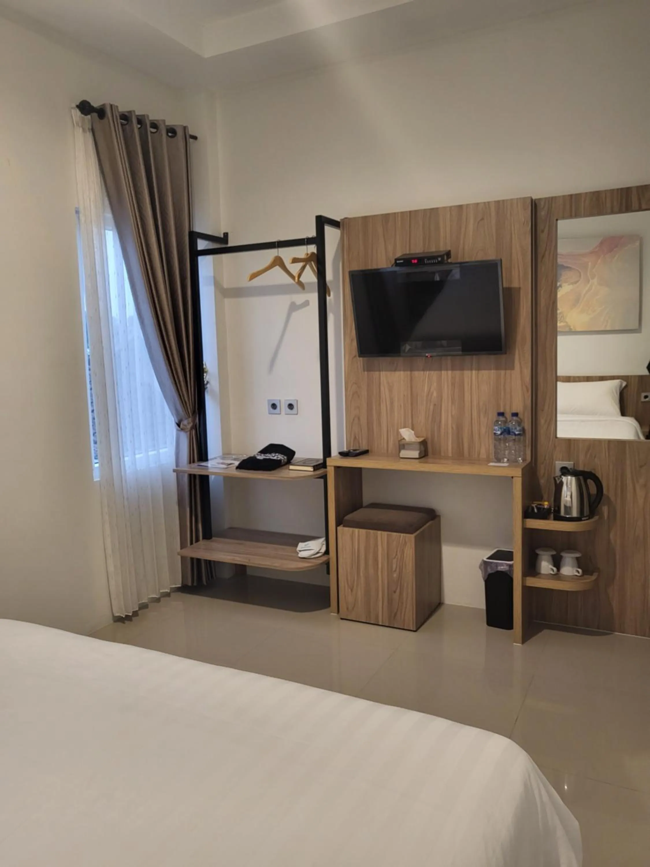 Communal lounge/ TV room, Bed in The Safiina Point Syariah Hotel