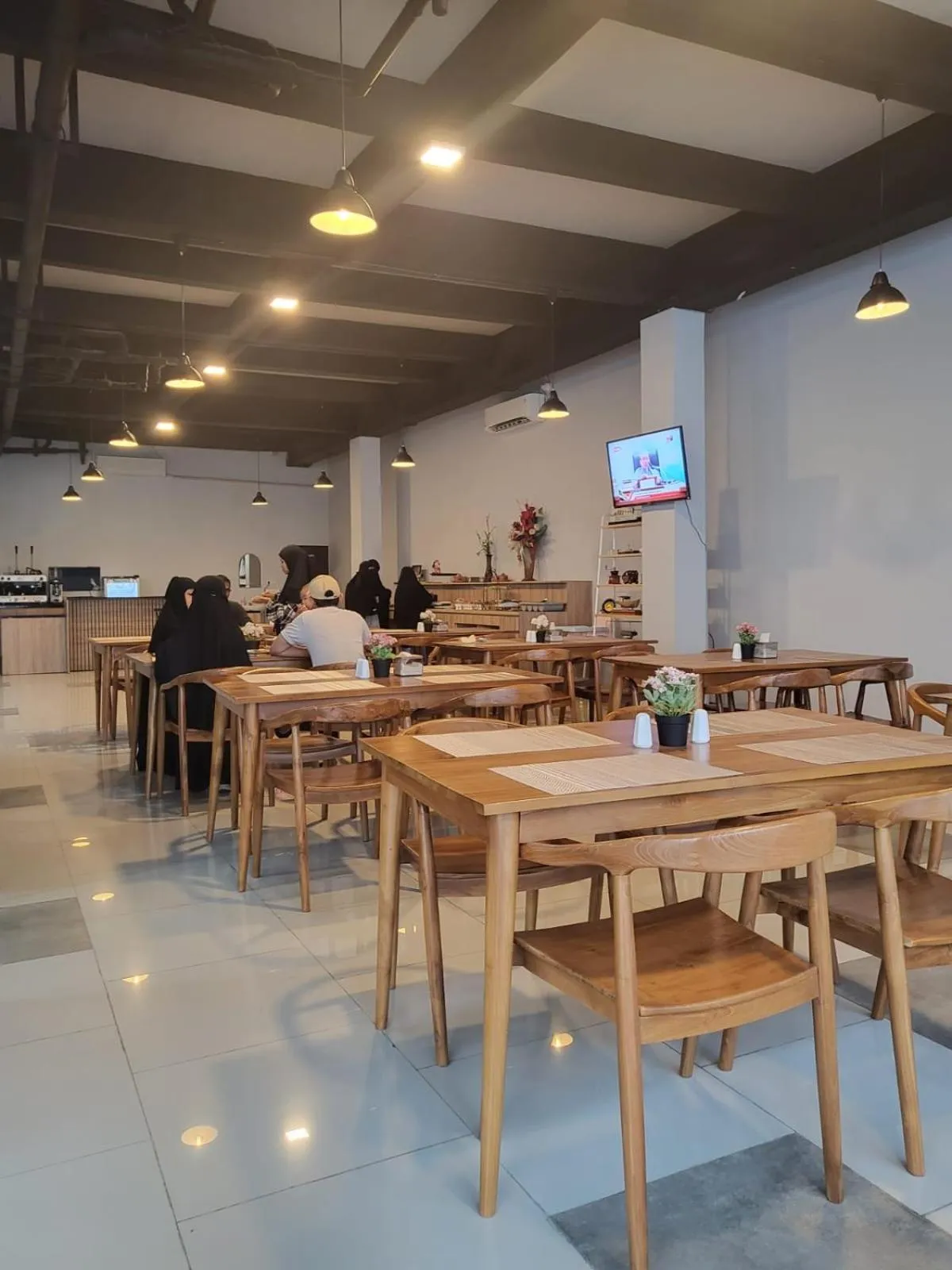 Communal lounge/ TV room in The Safiina Point Syariah Hotel