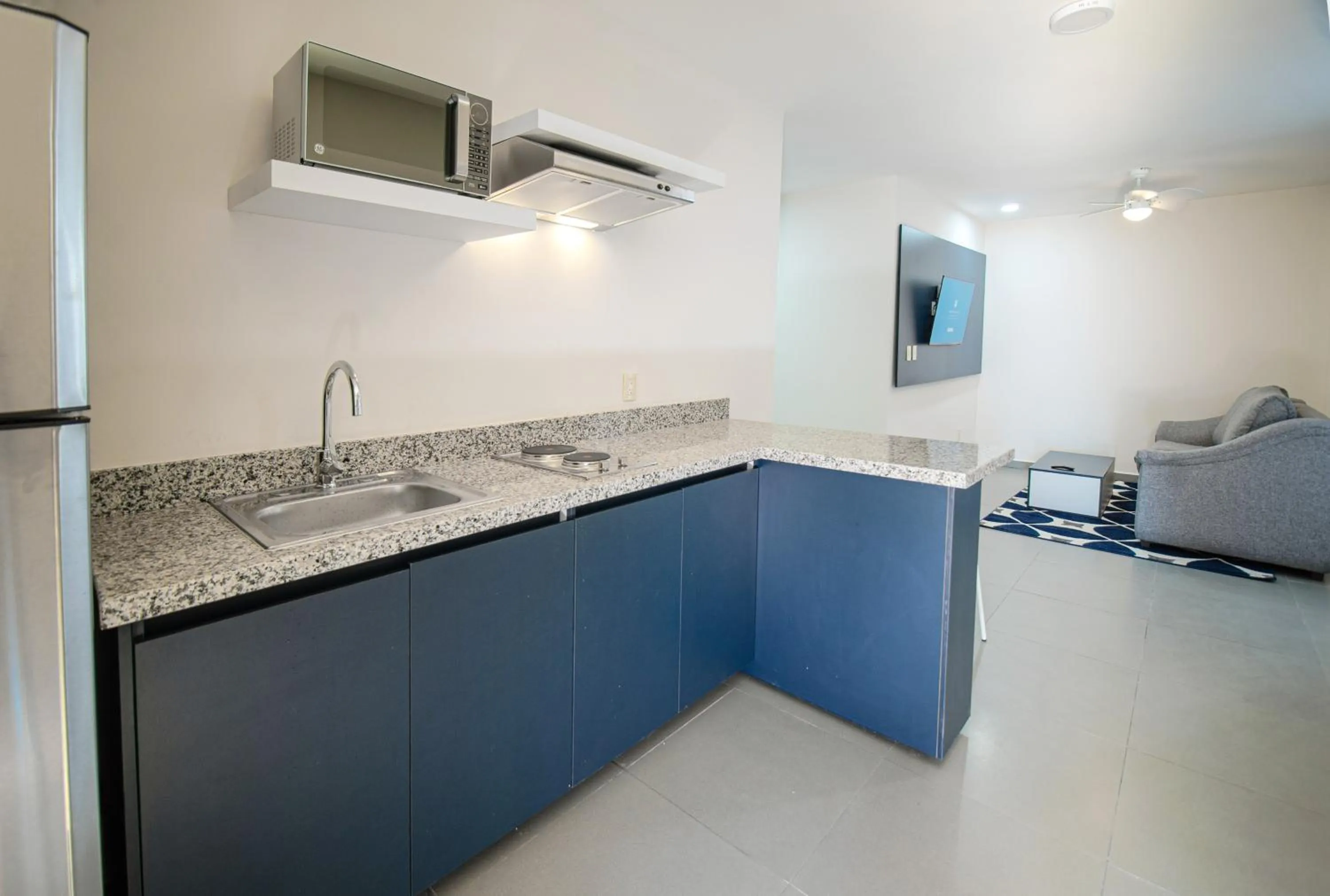 kitchen in Vista Express Guadalajara Expo SureStay Collection by BW