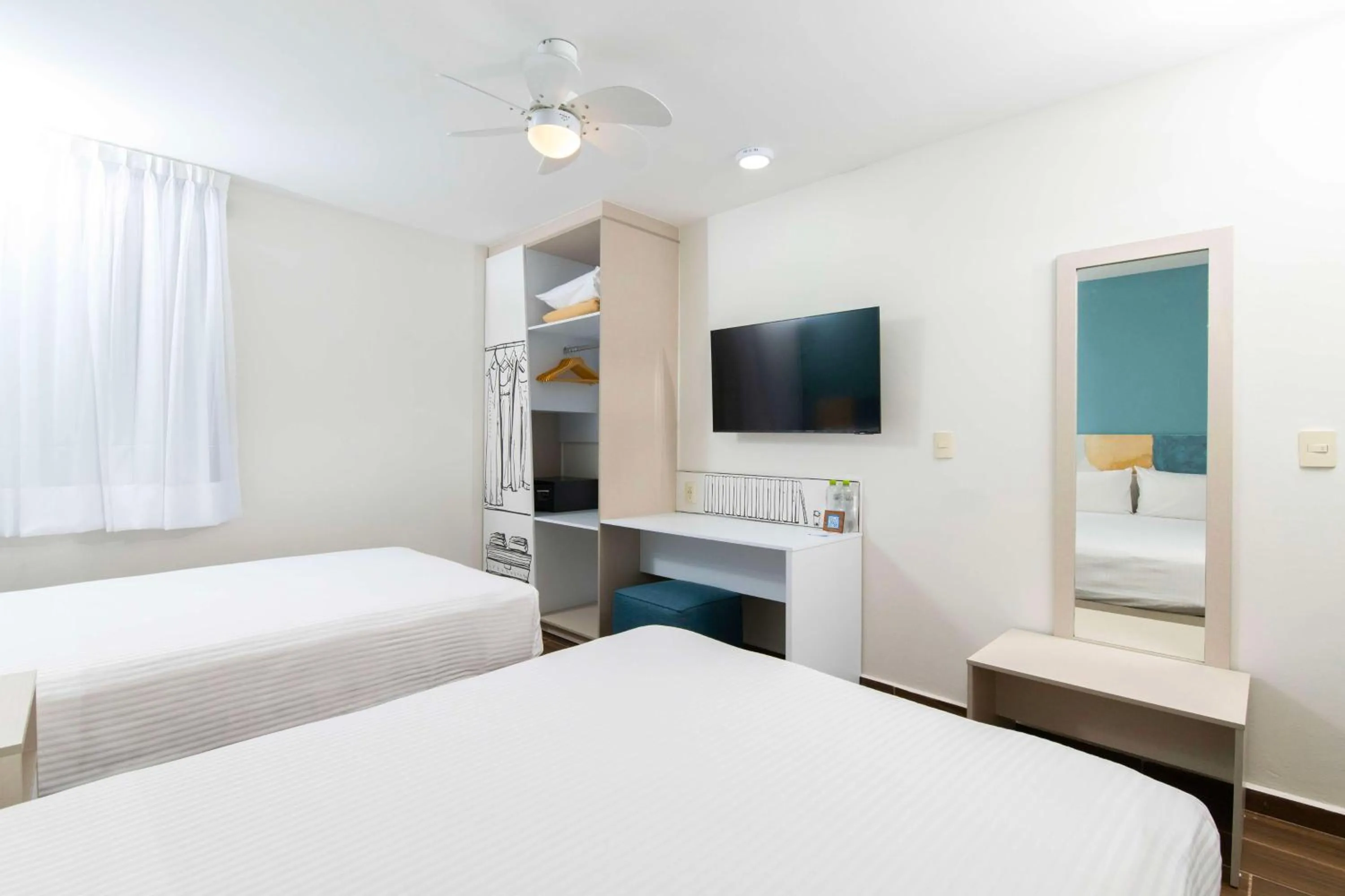 Bedroom, Bed in Vista Express Guadalajara Expo SureStay Collection by BW