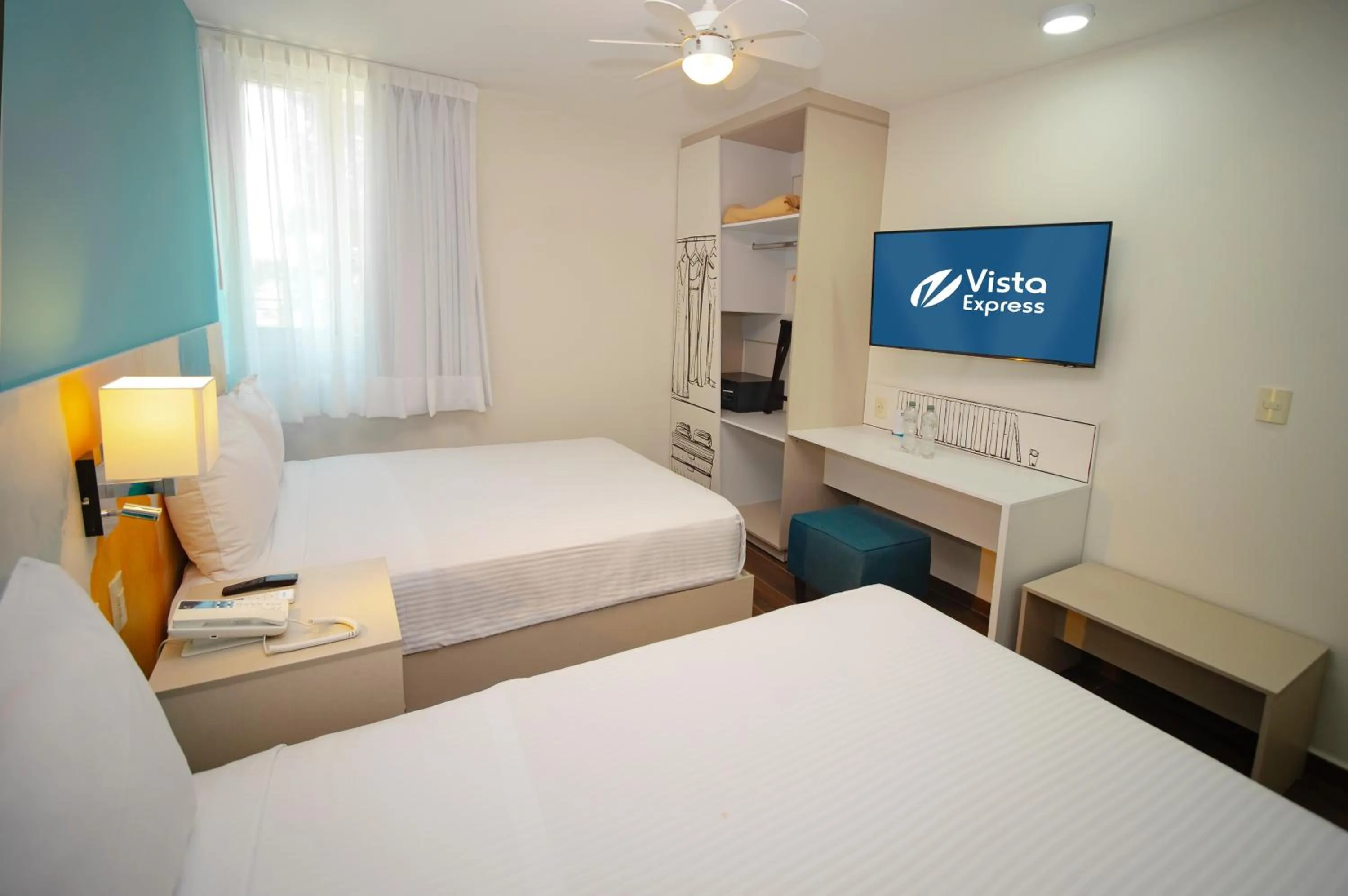 Bed in Vista Express Guadalajara Expo SureStay Collection by BW