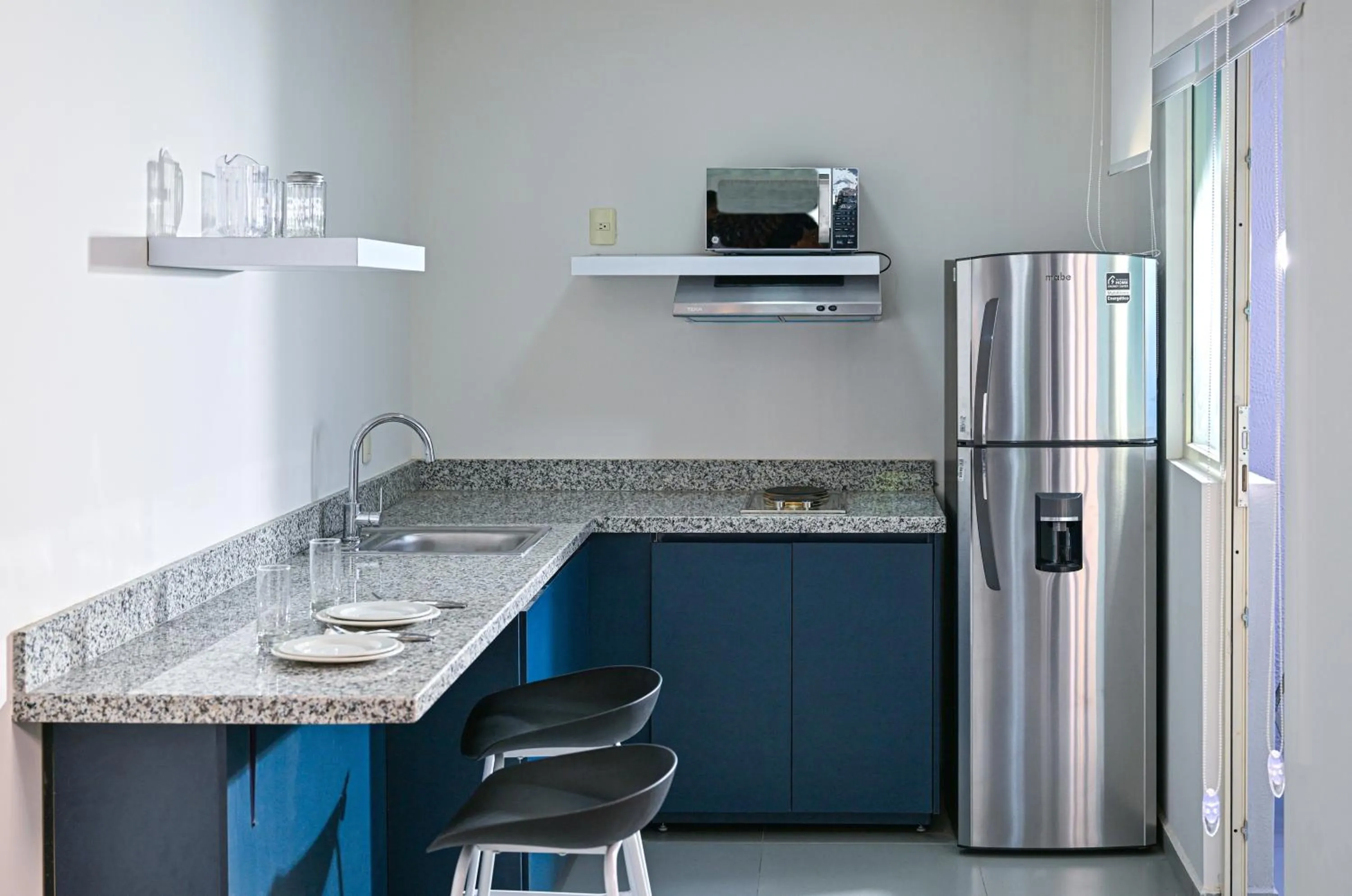 kitchen in Vista Express Guadalajara Expo SureStay Collection by BW