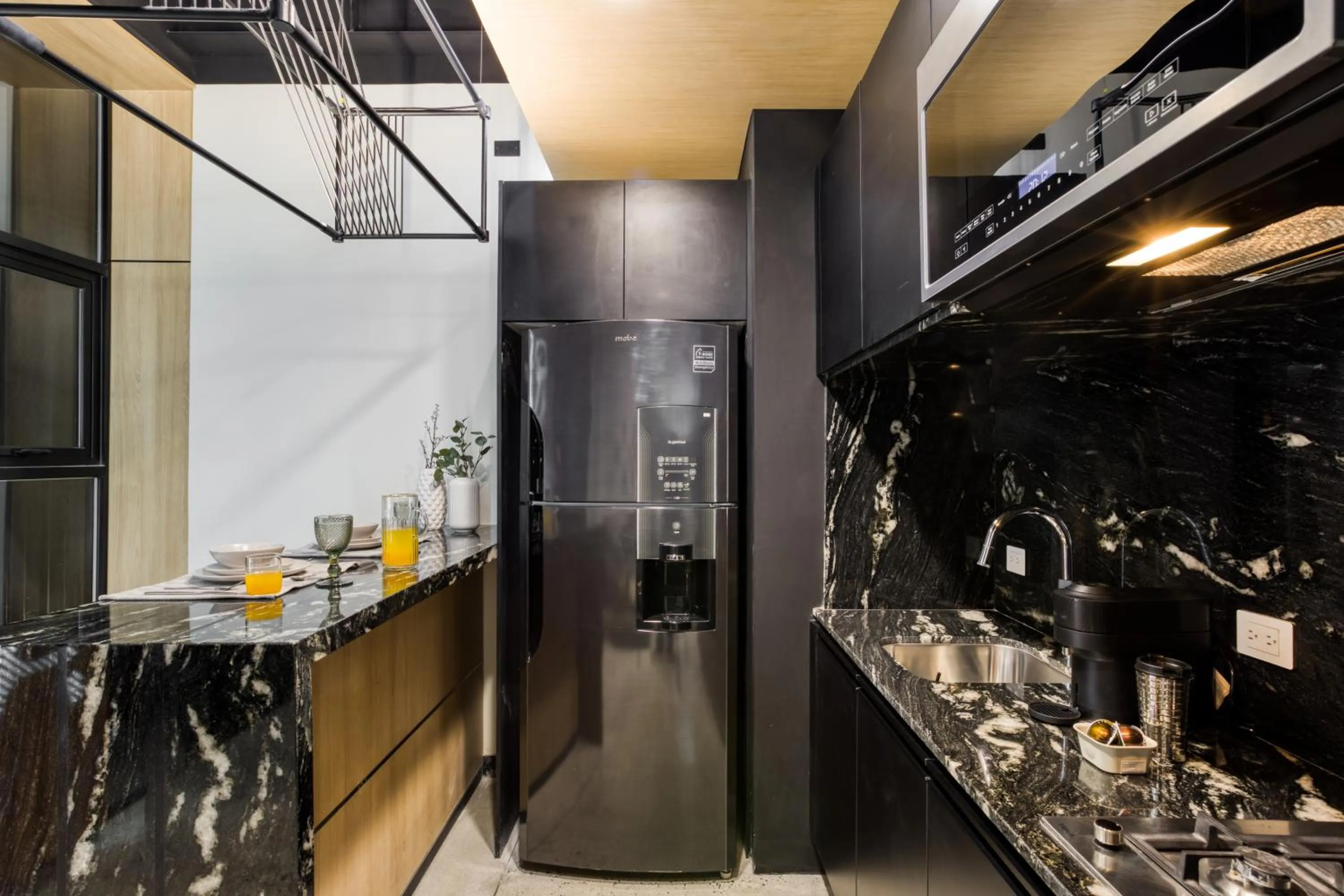 kitchen in Downtown Designer Apartments by ULIV