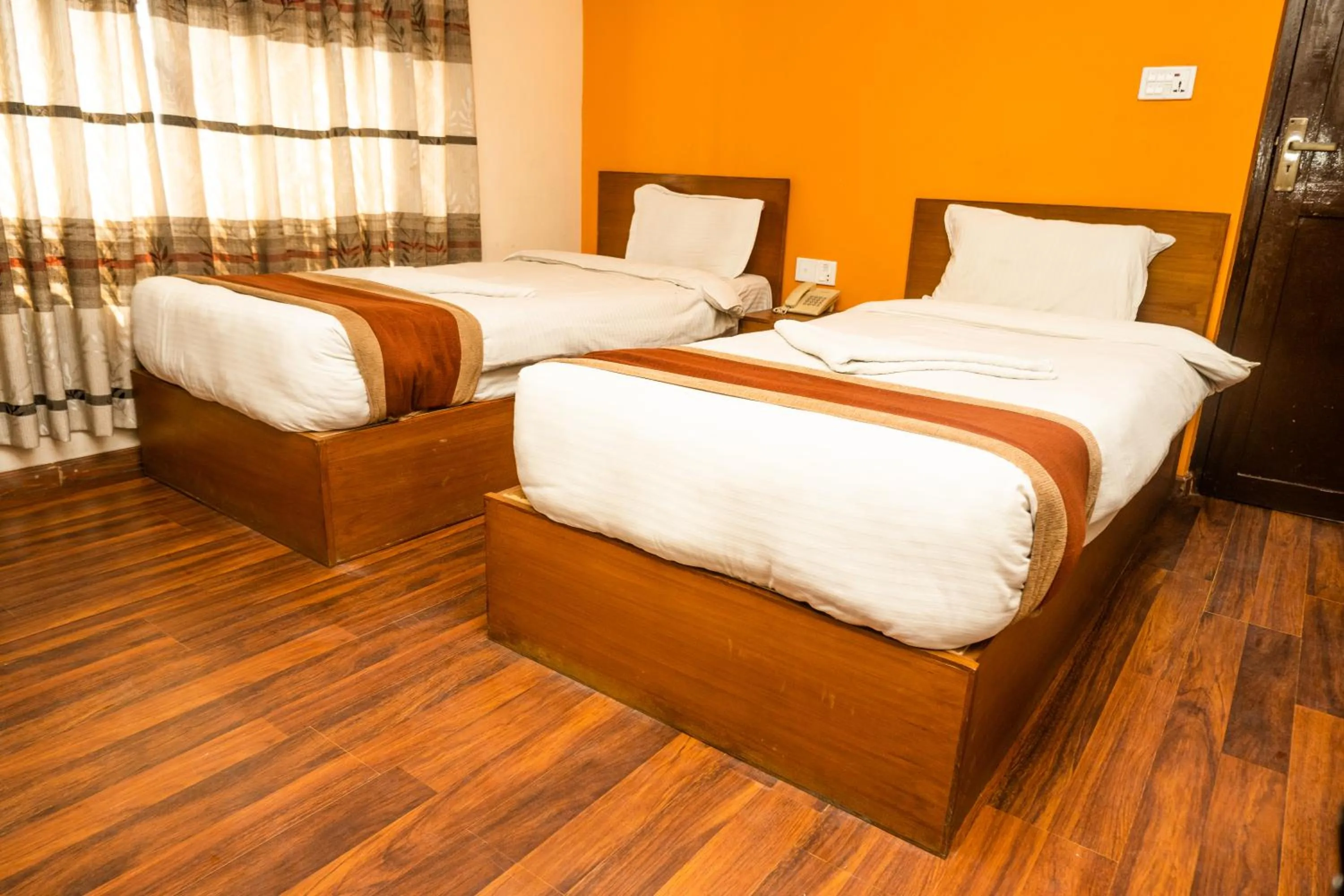 Photo of the whole room, Bed in Kathmandu Peace Hotel