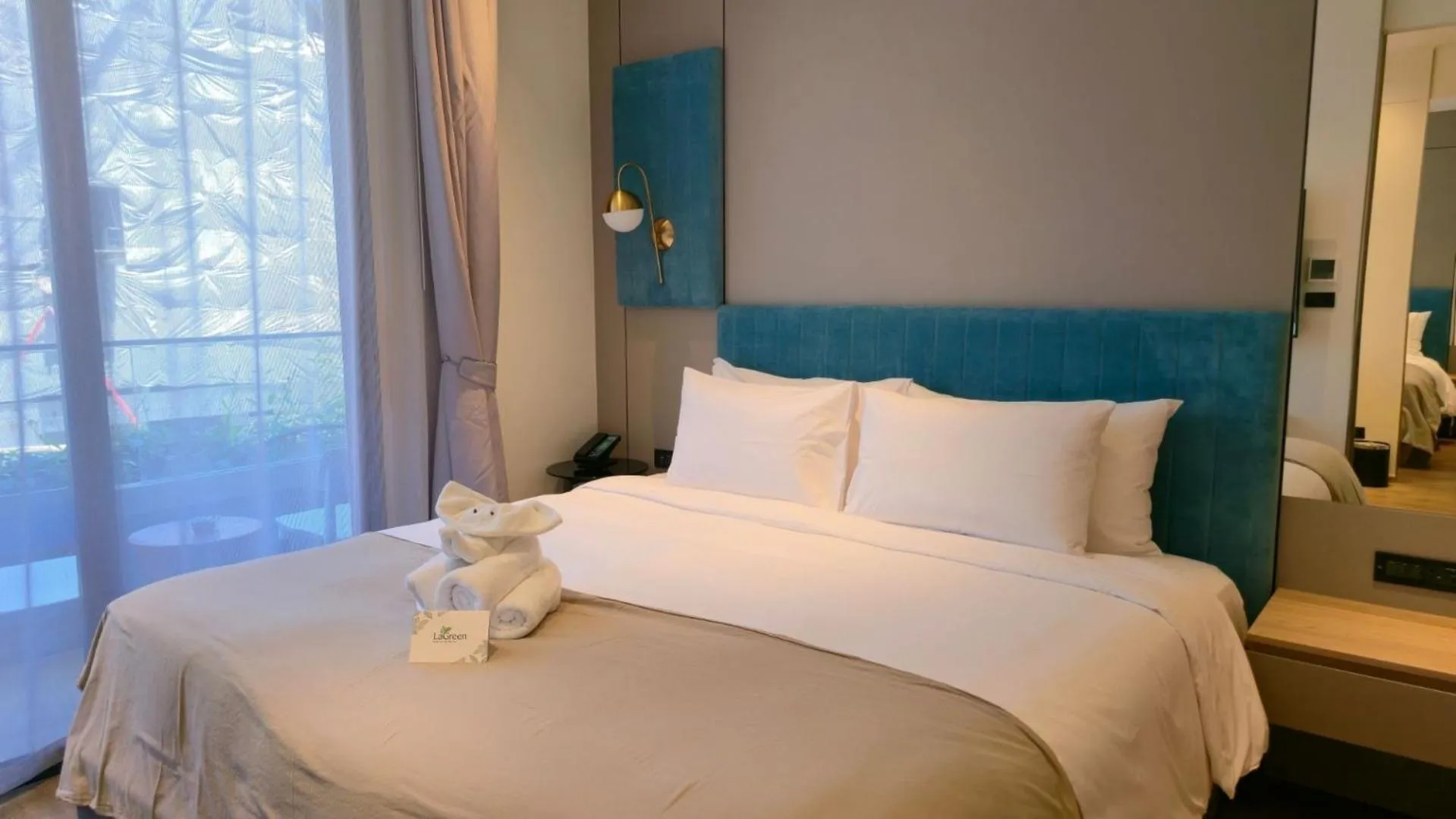 Bed in La Green Hotel and Residence