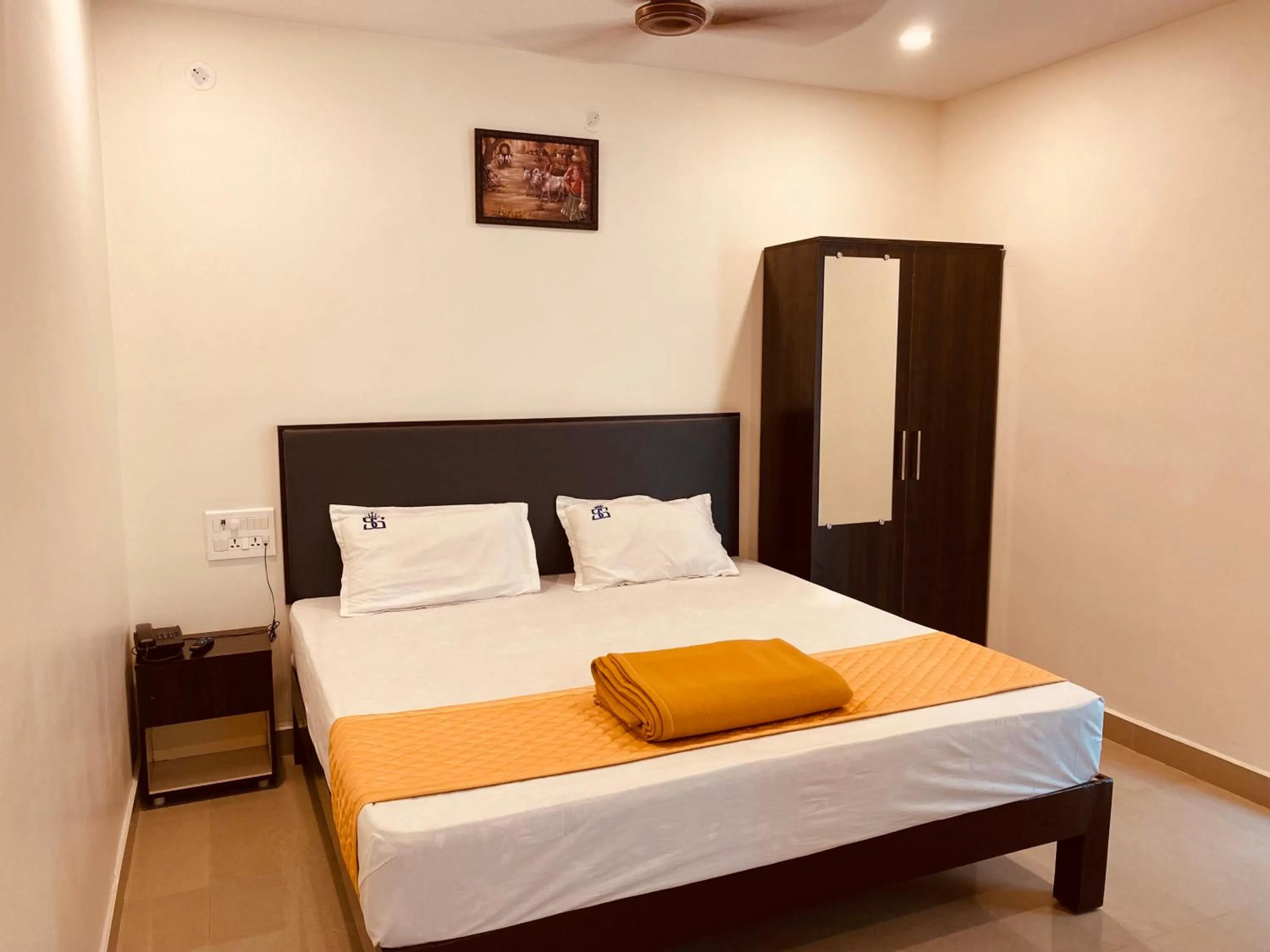 Bed in Hotel Sitar Grand