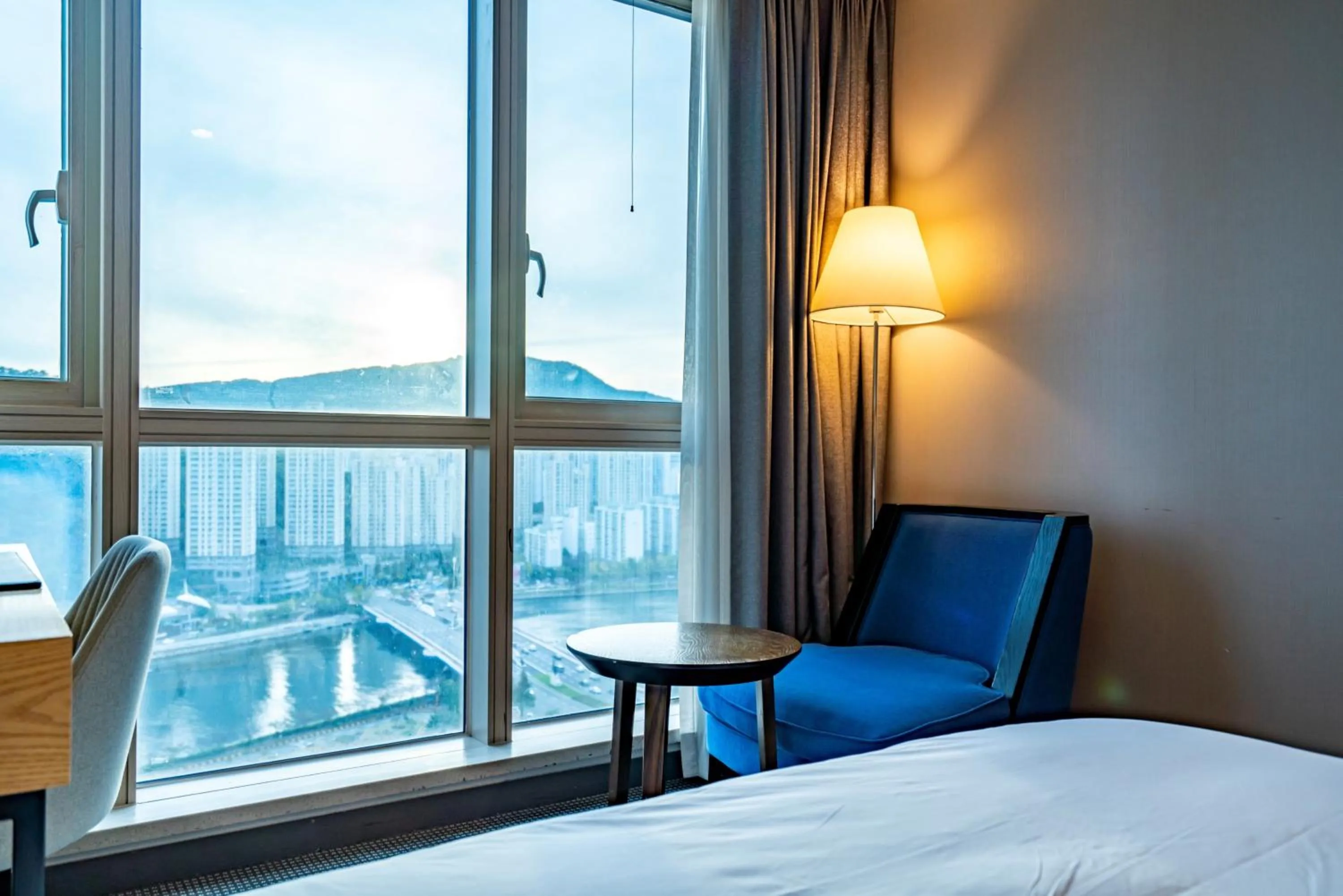 Seating area, Bed in Centum Business Hotel