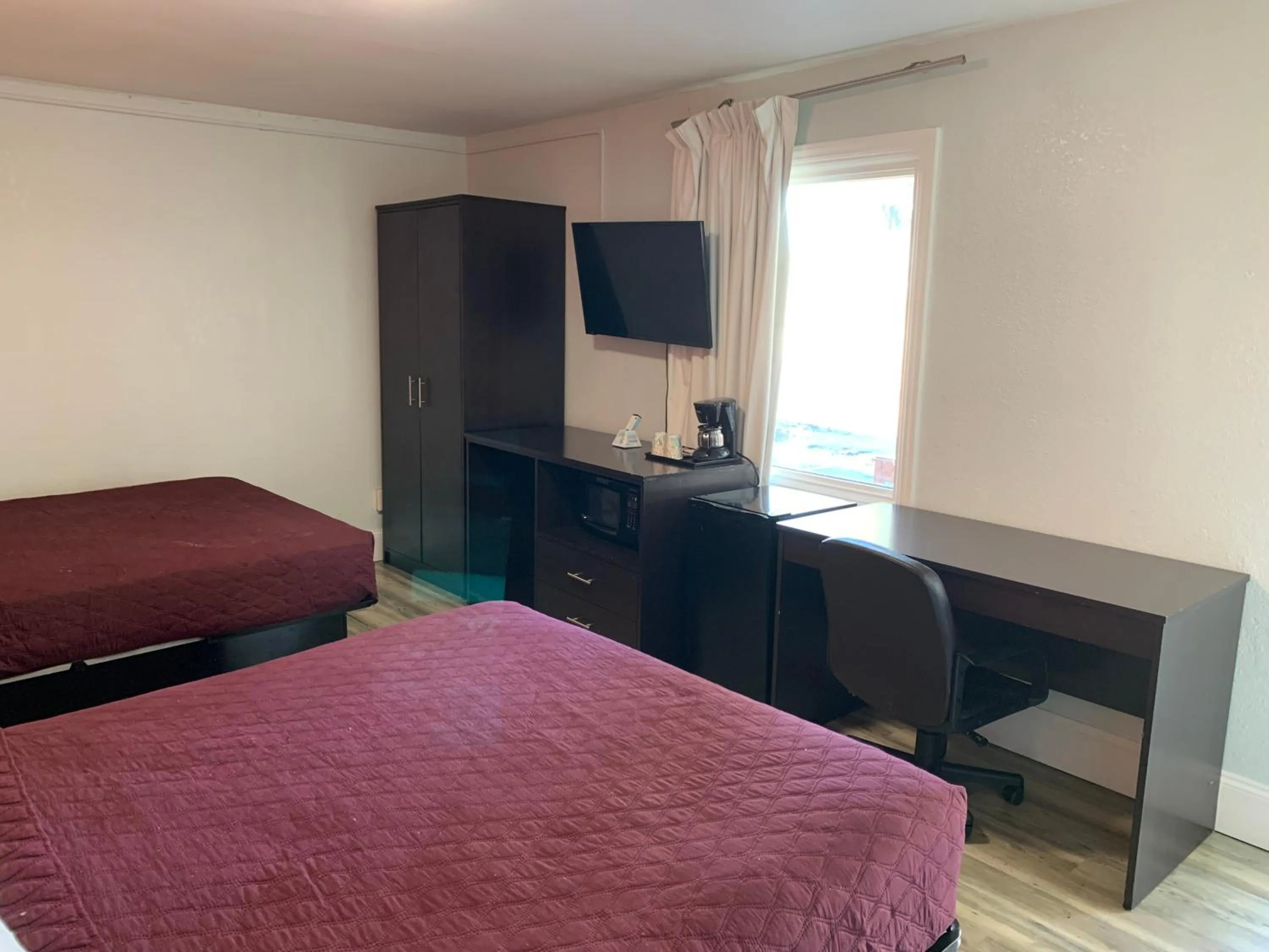 Bed in Whispering Pines Motel