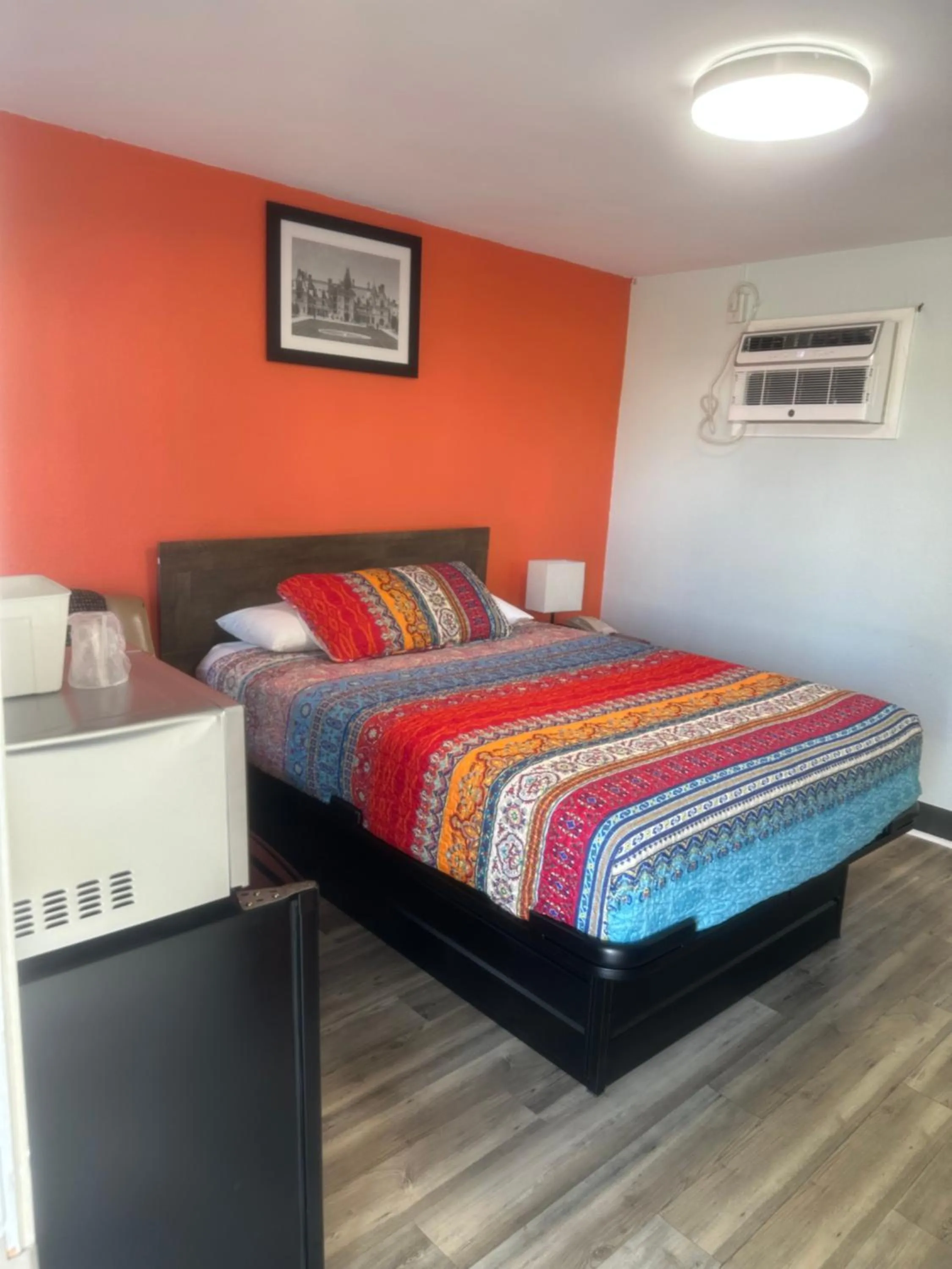 Bed in Whispering Pines Motel