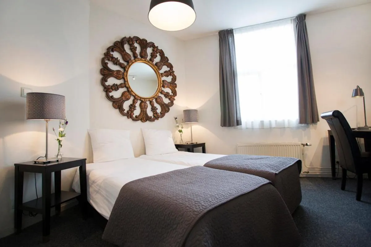 Bed in Quentin Amsterdam Hotel