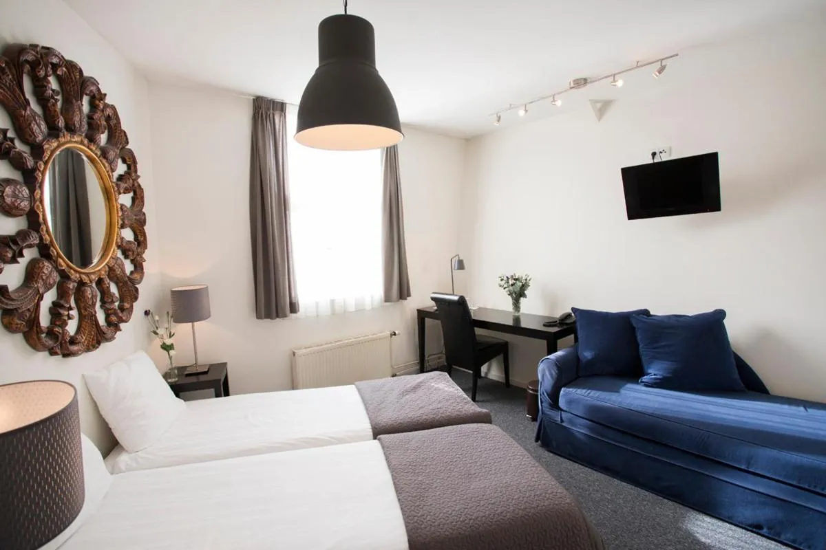 Bed in Quentin Amsterdam Hotel