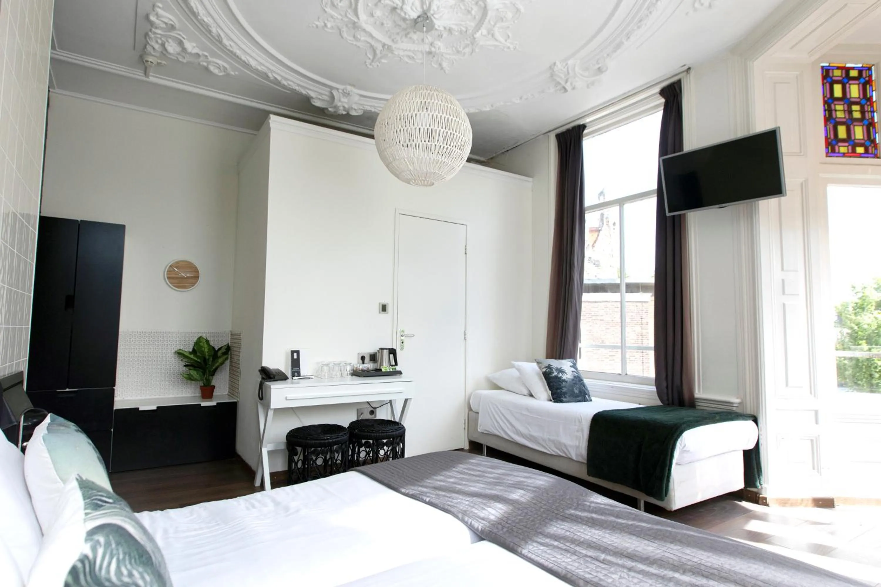 Bed in Quentin Amsterdam Hotel