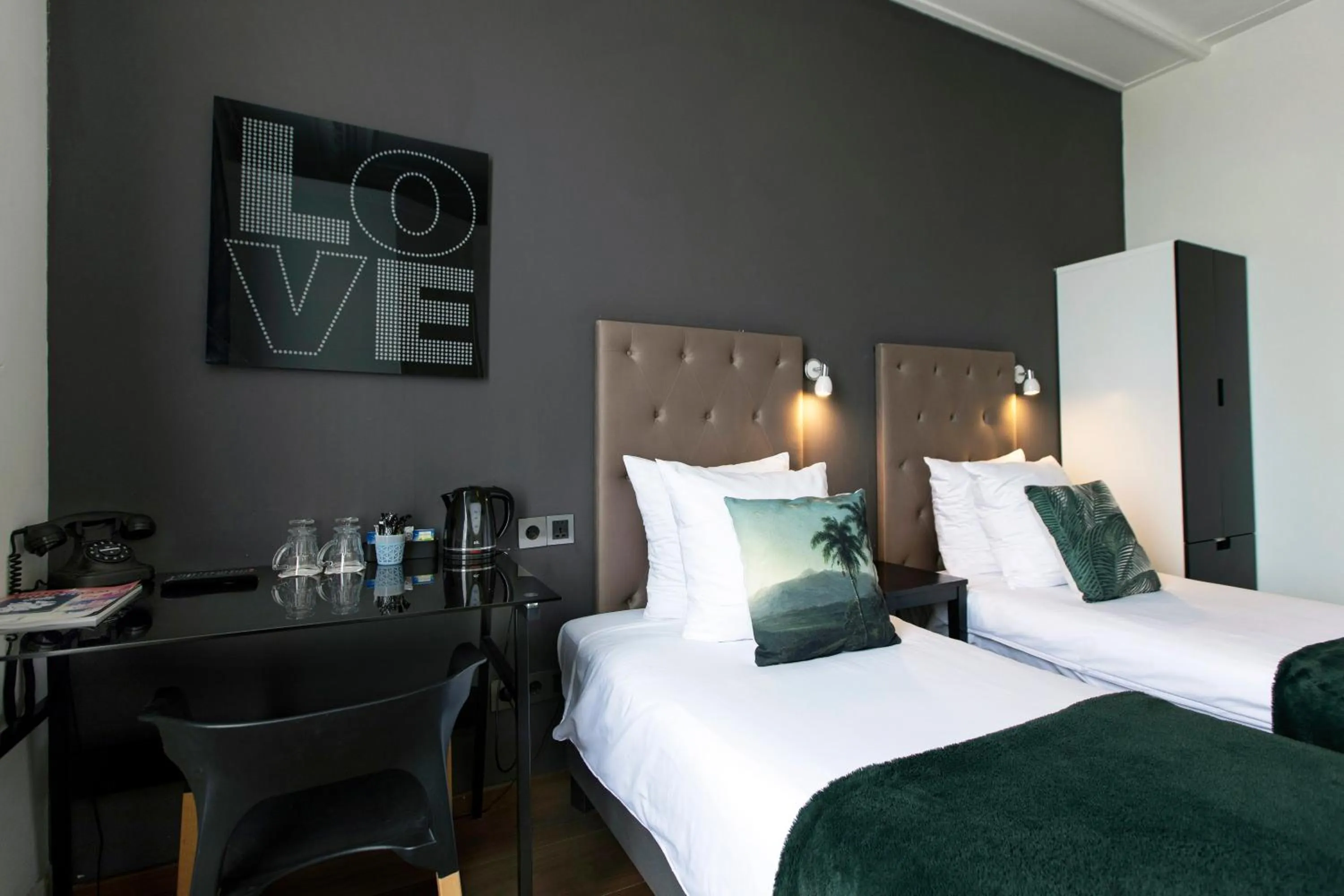 Bed in Quentin Amsterdam Hotel