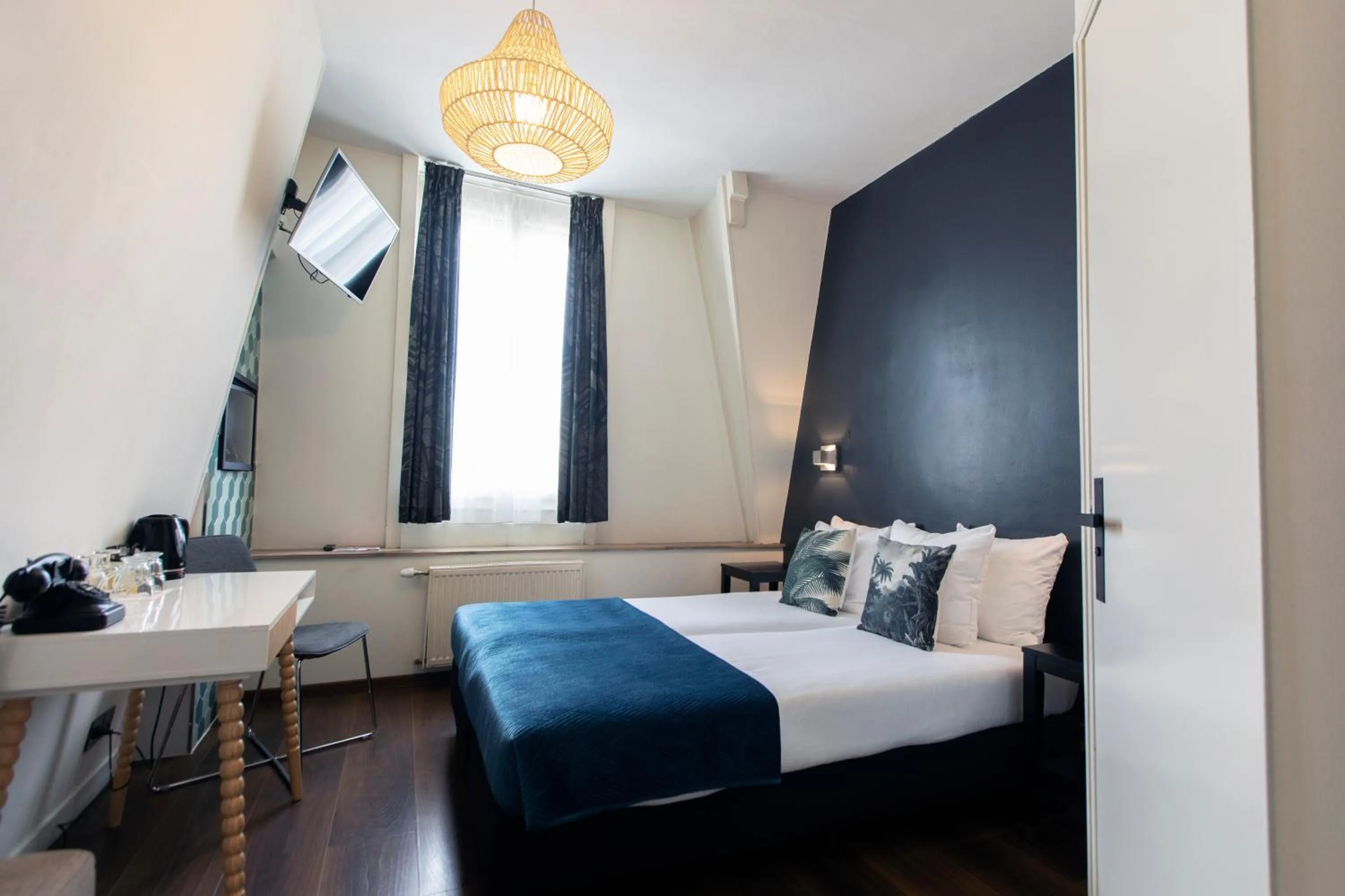 Bed in Quentin Amsterdam Hotel