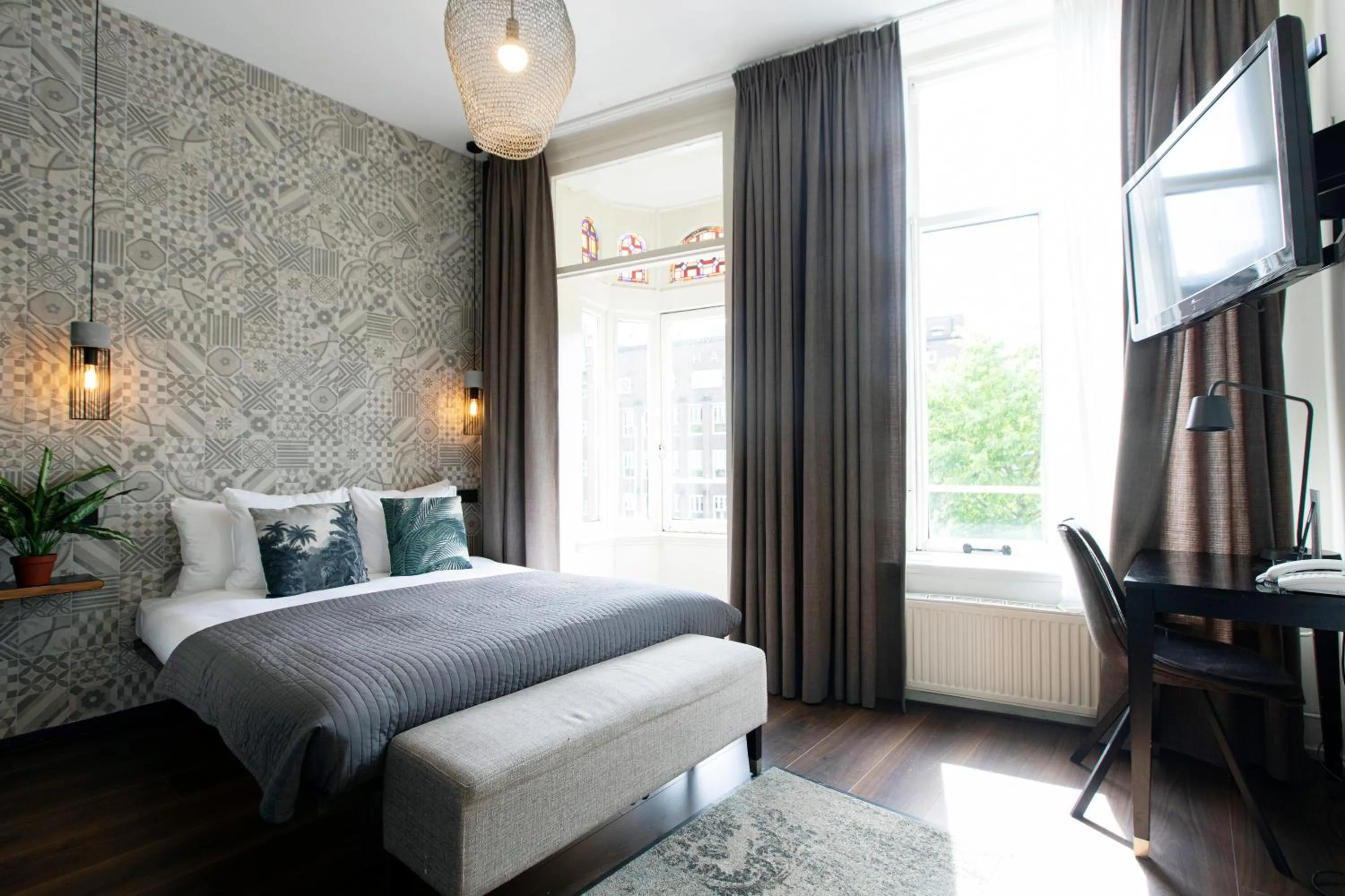 Bed in Quentin Amsterdam Hotel