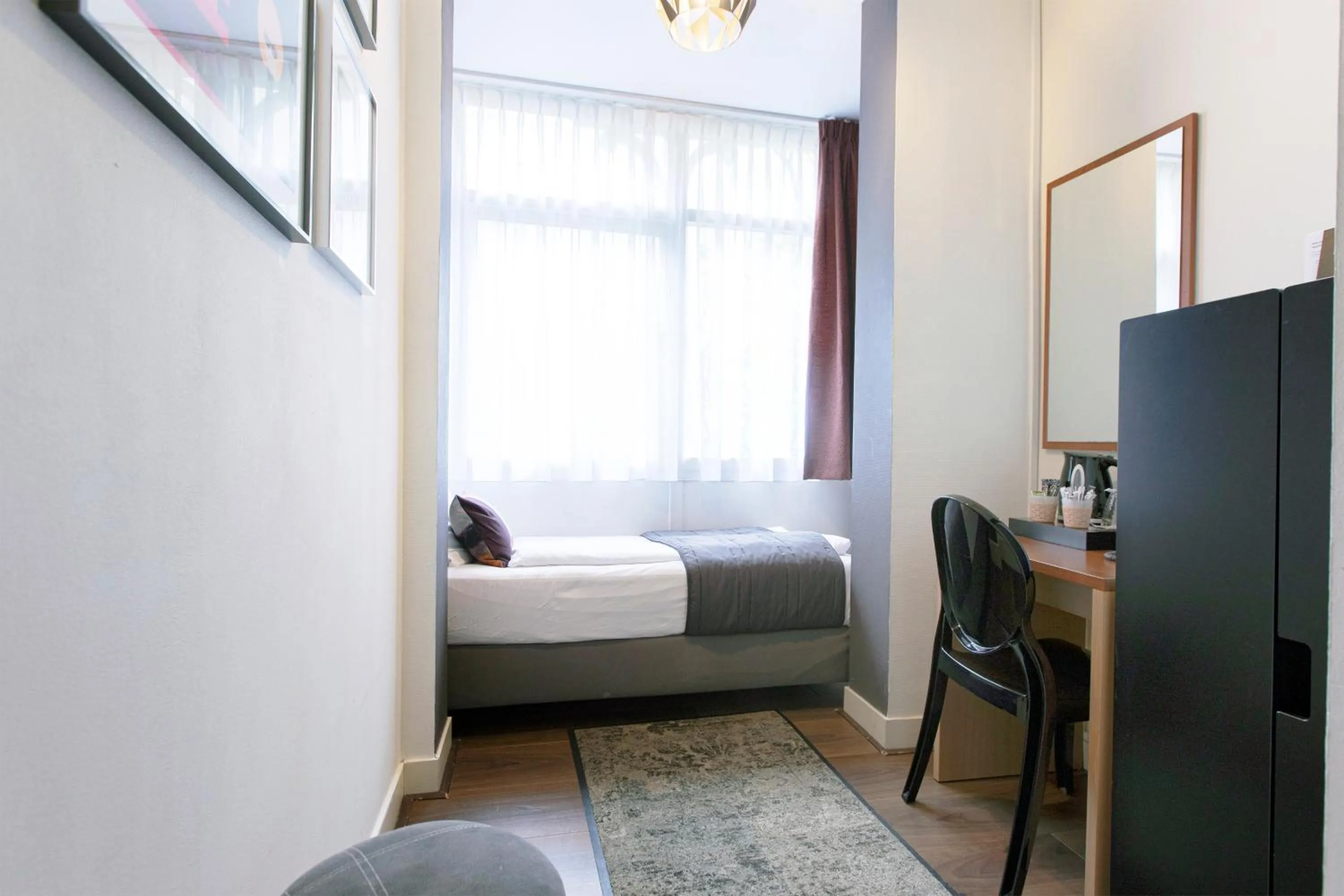 Bed in Quentin Amsterdam Hotel