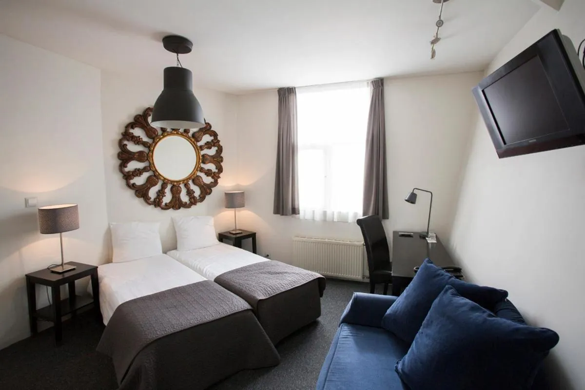 Bed in Quentin Amsterdam Hotel