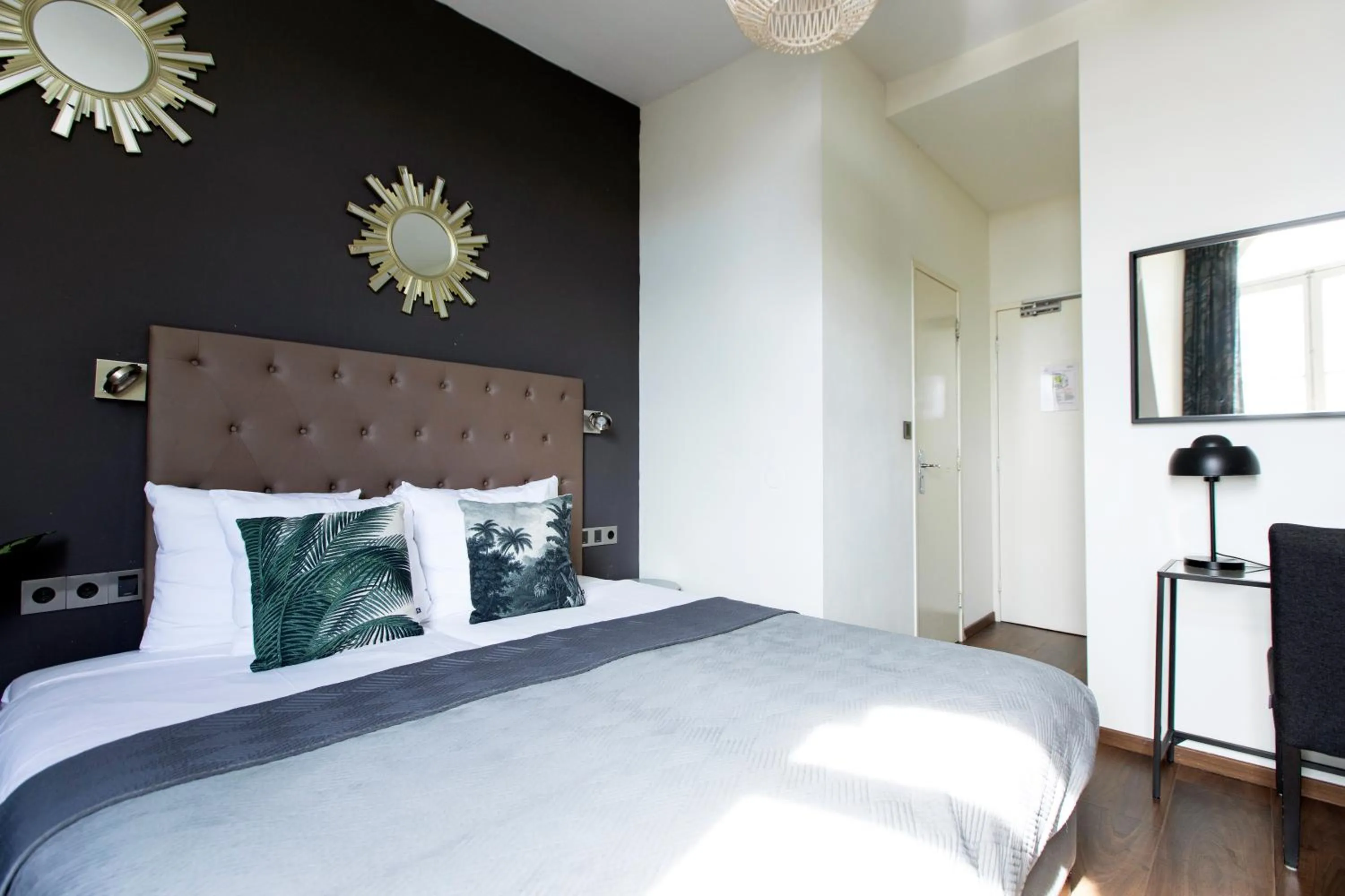 Bed in Quentin Amsterdam Hotel