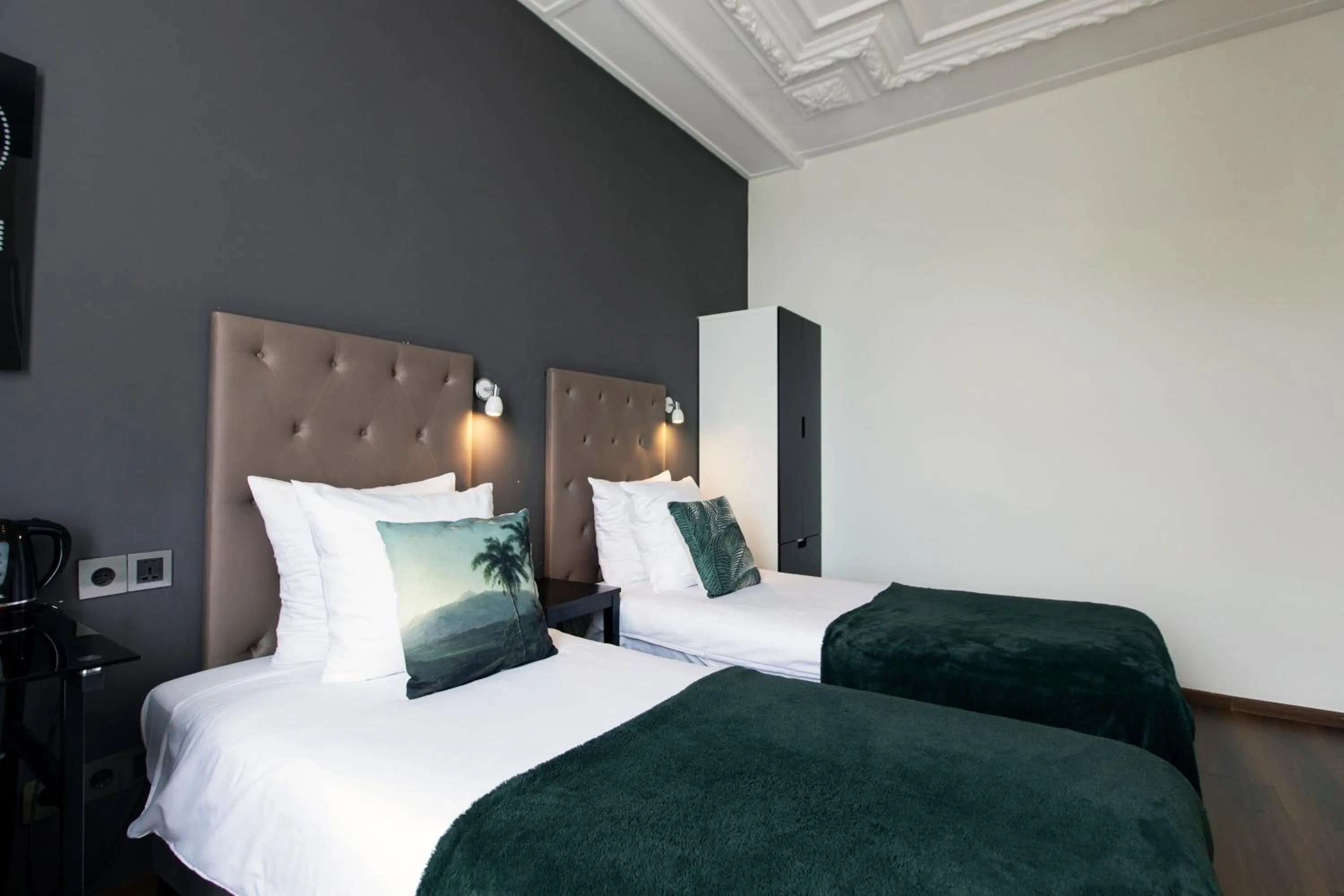 Bed in Quentin Amsterdam Hotel