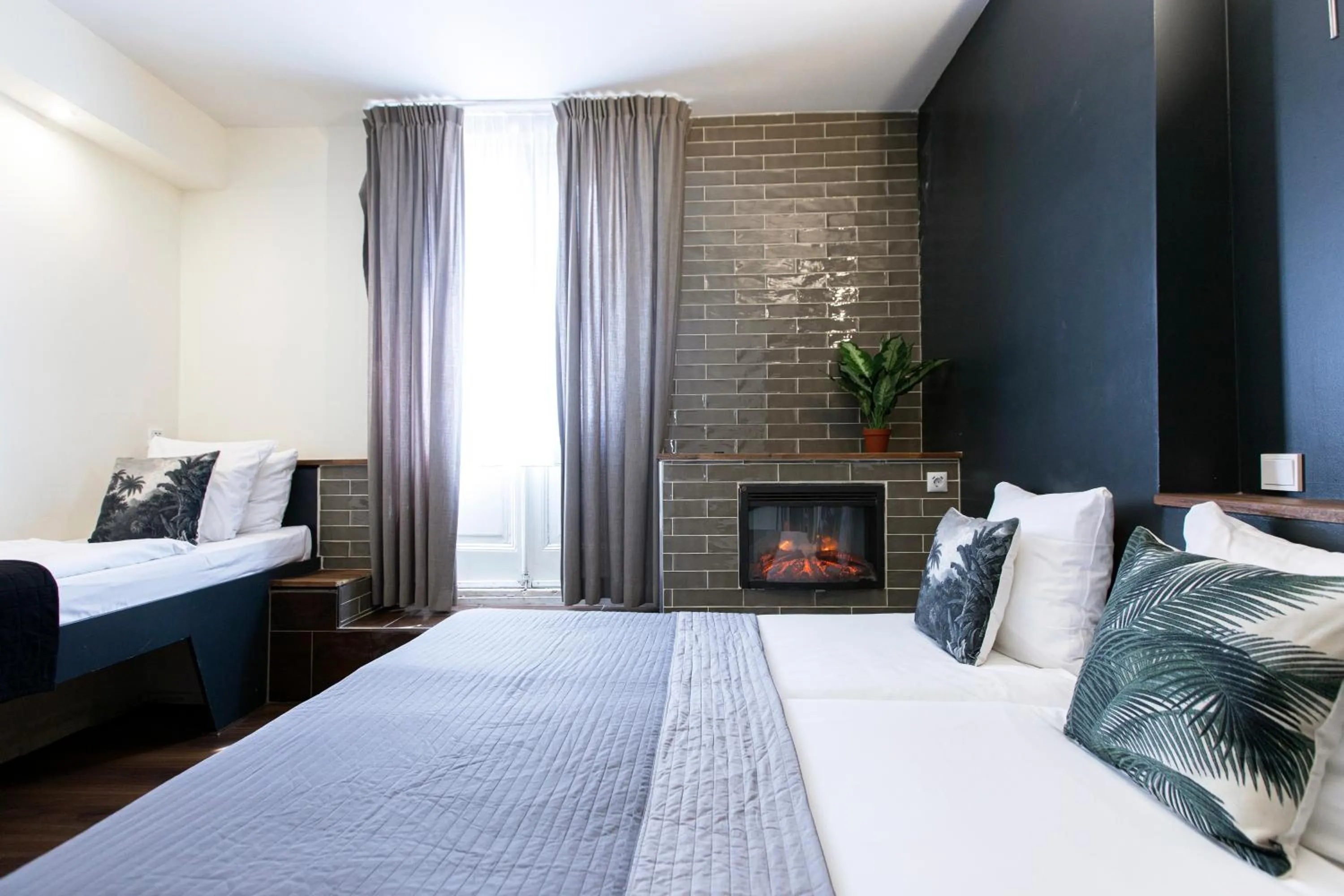 Bed in Quentin Amsterdam Hotel