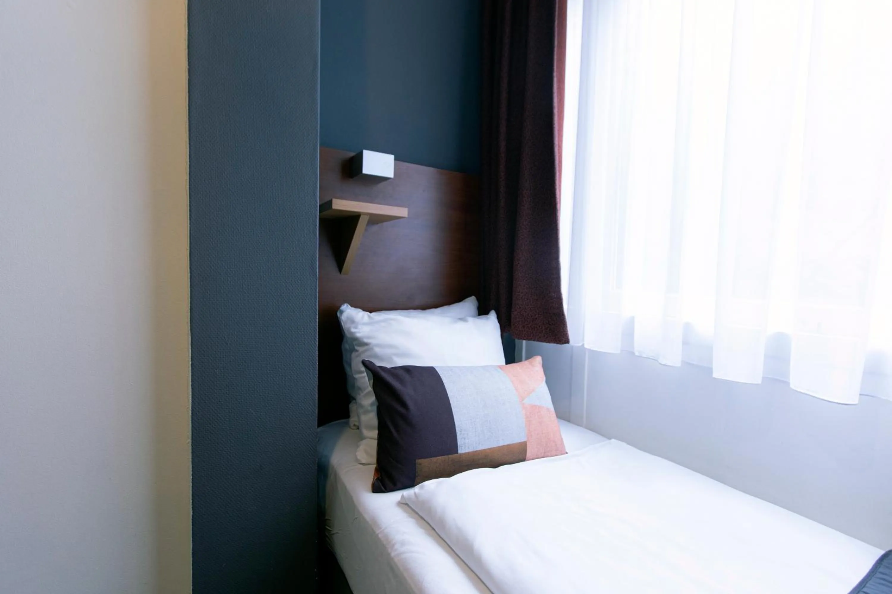 Bed in Quentin Amsterdam Hotel