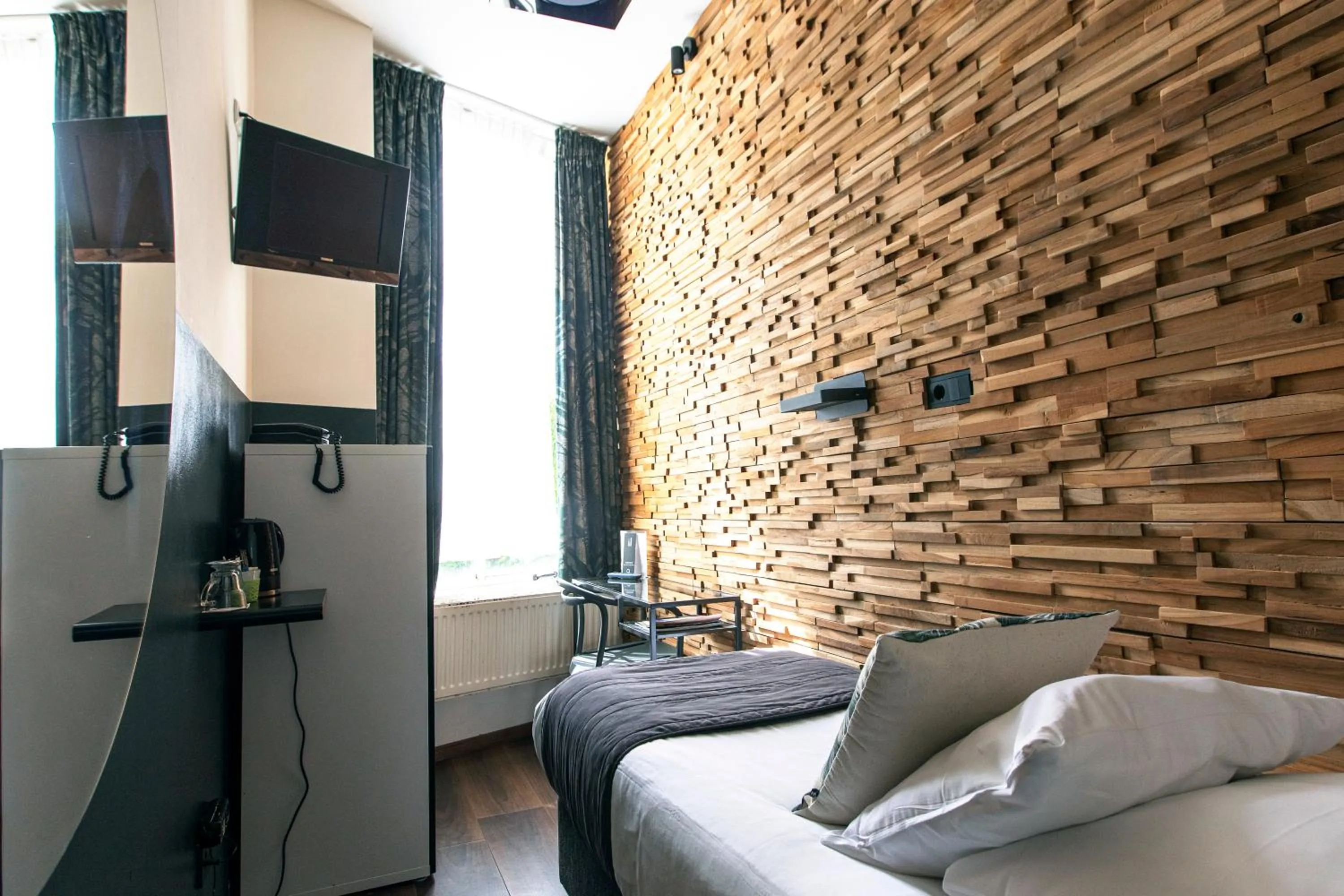 Bed in Quentin Amsterdam Hotel