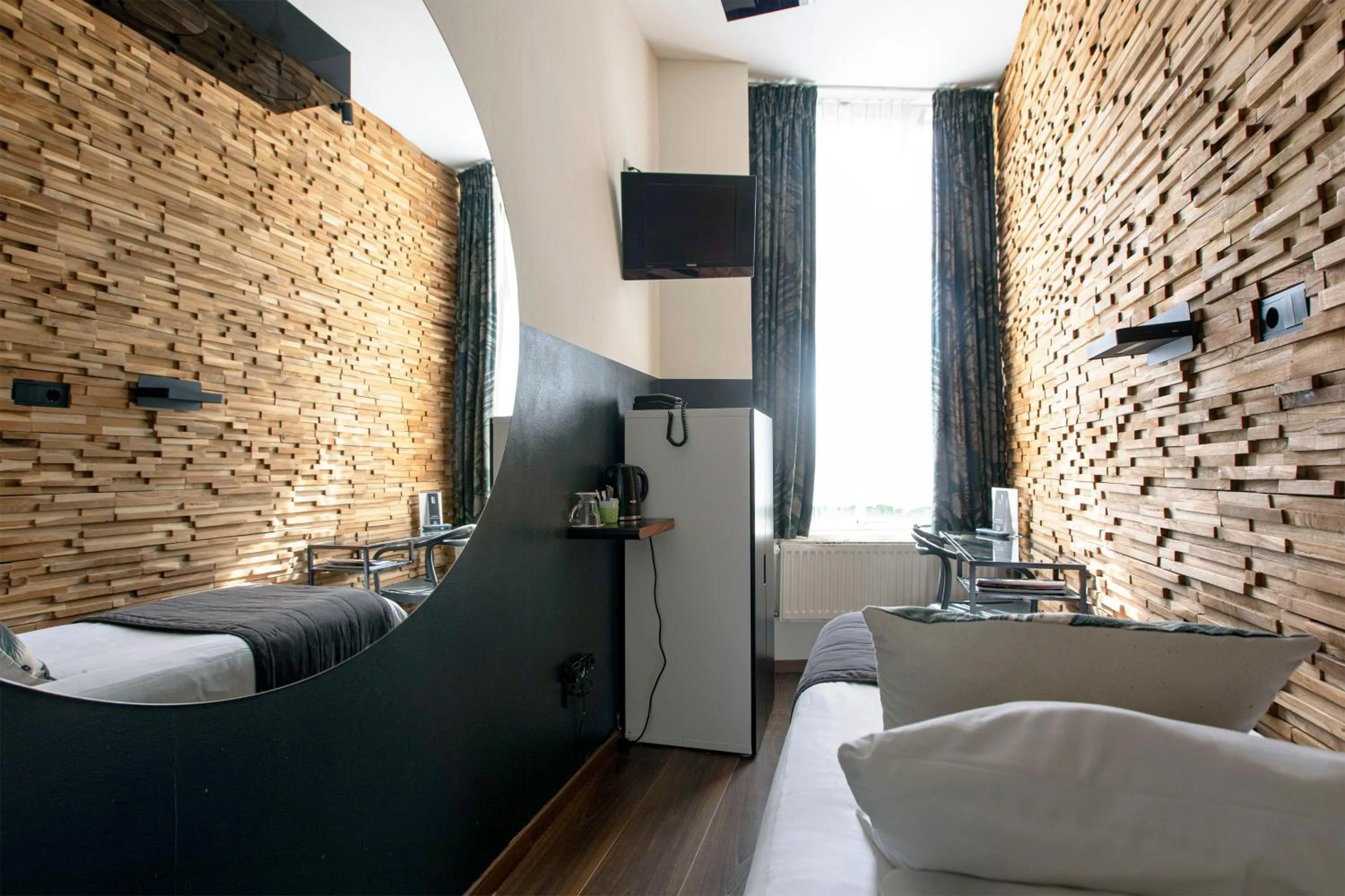 Bed in Quentin Amsterdam Hotel