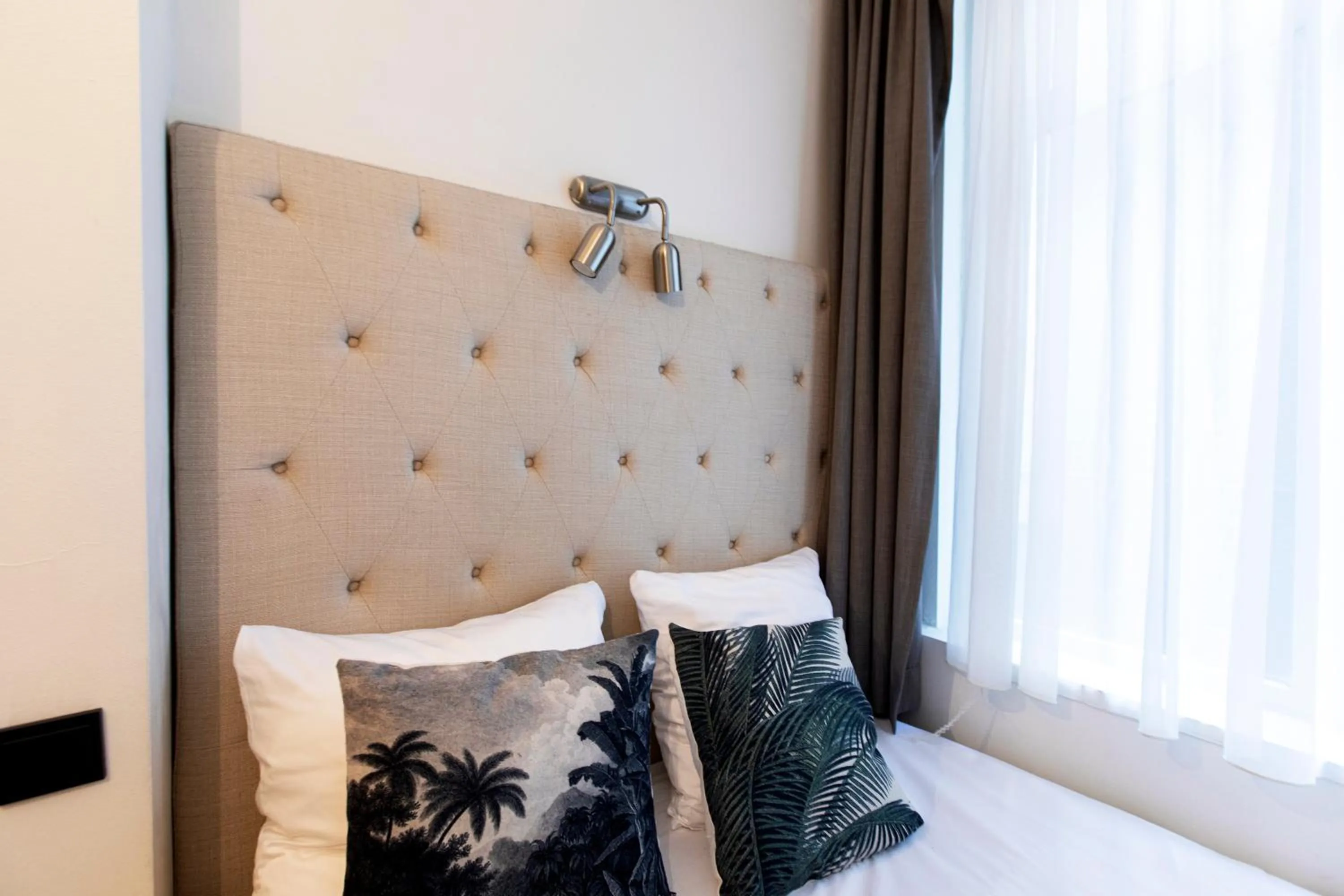 Bed in Quentin Amsterdam Hotel