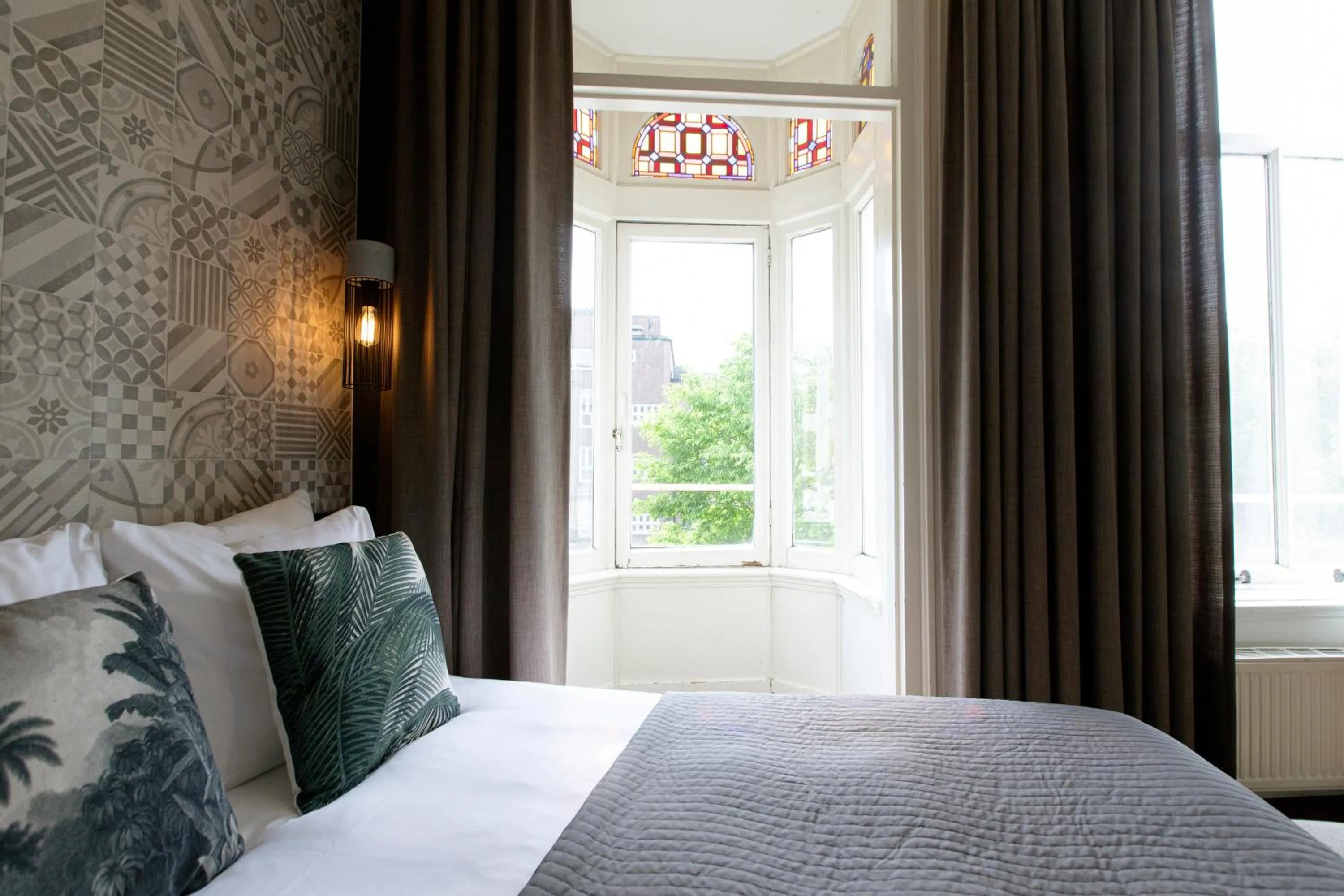 Bed in Quentin Amsterdam Hotel