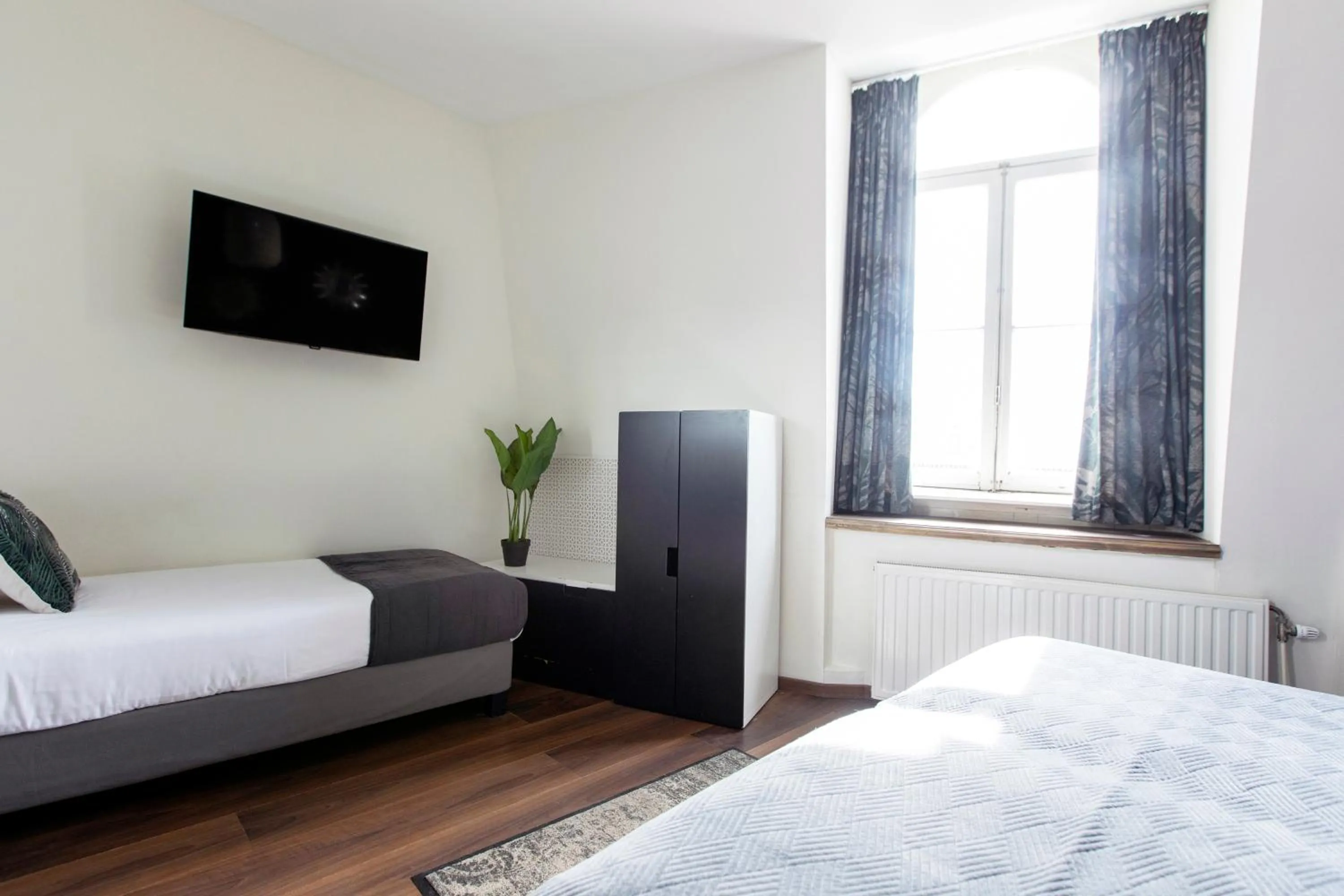 Bed in Quentin Amsterdam Hotel