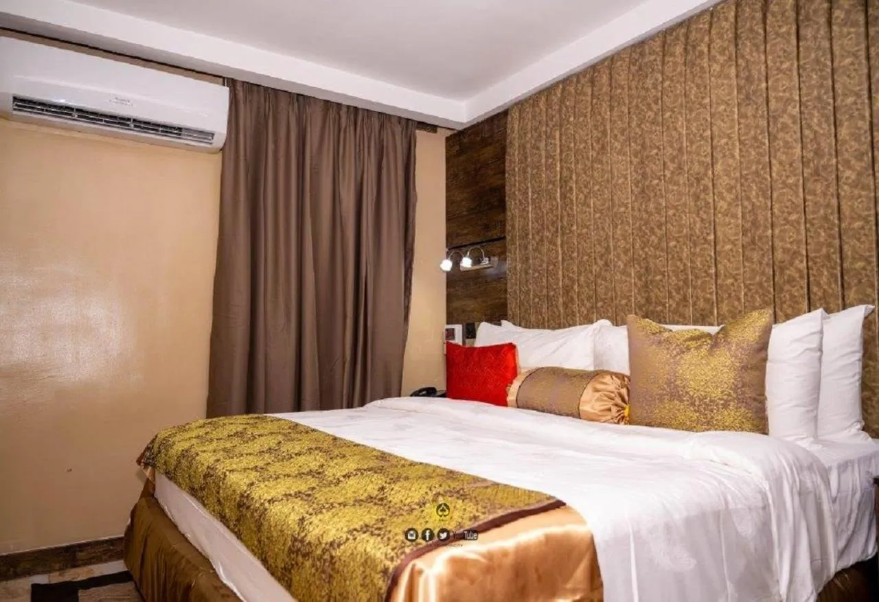 Bed in Joker Hotel and Suites