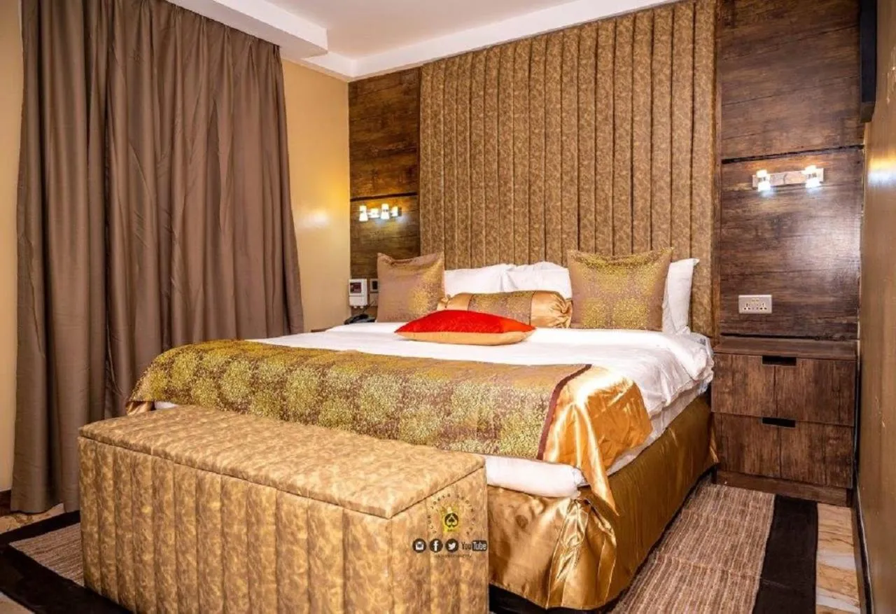 Bed in Joker Hotel and Suites