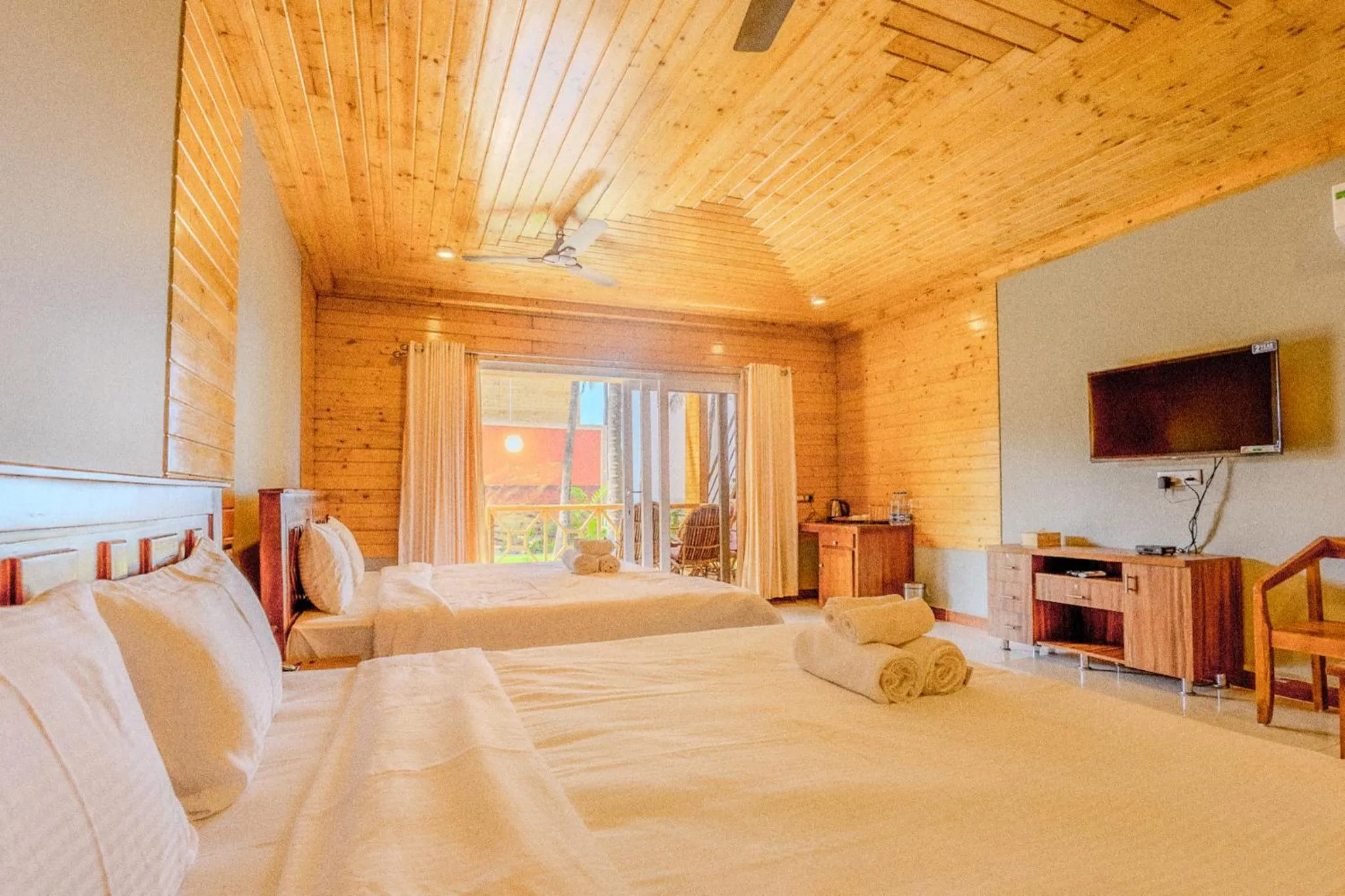 Communal lounge/ TV room, Bed in The O2H Agonda Beach Resort