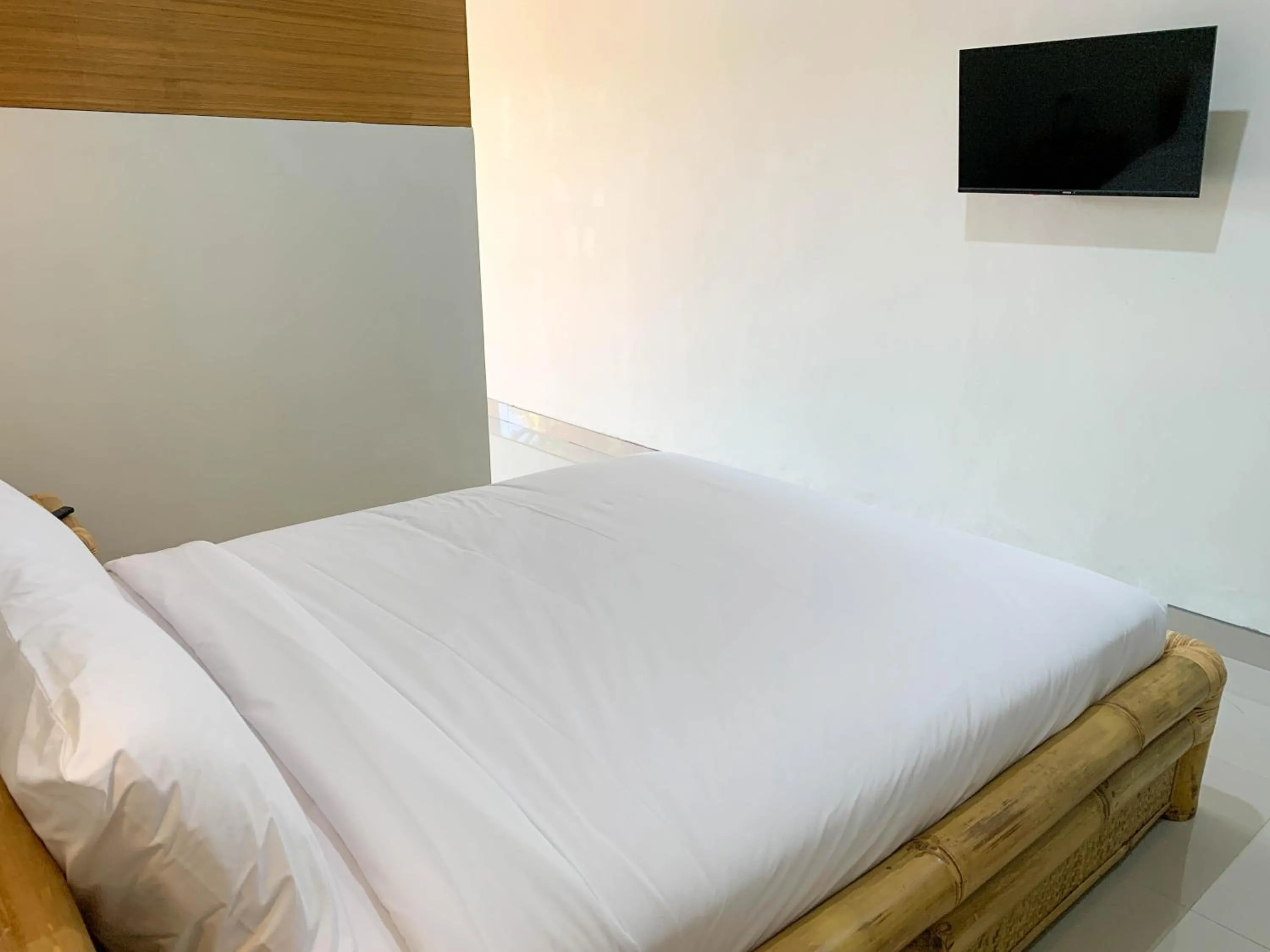 Bed in Candra Loka Studio & Apartment by The Loka