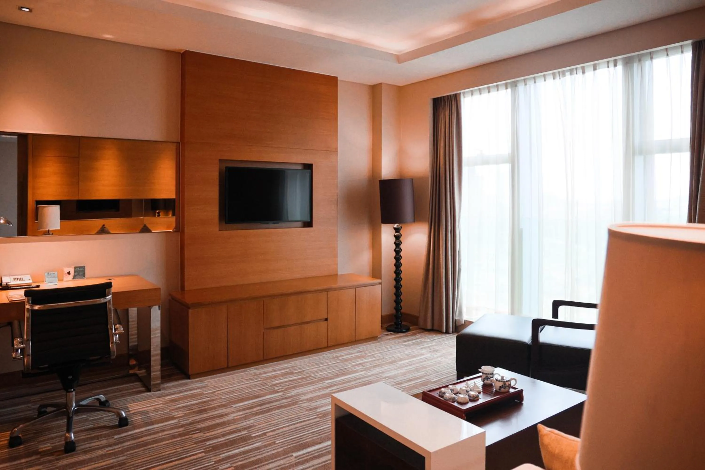 Living room in Junluxe Hotel Guangzhou Science City-Free Shuttle Bus Service to Guangzhou Canton Fair