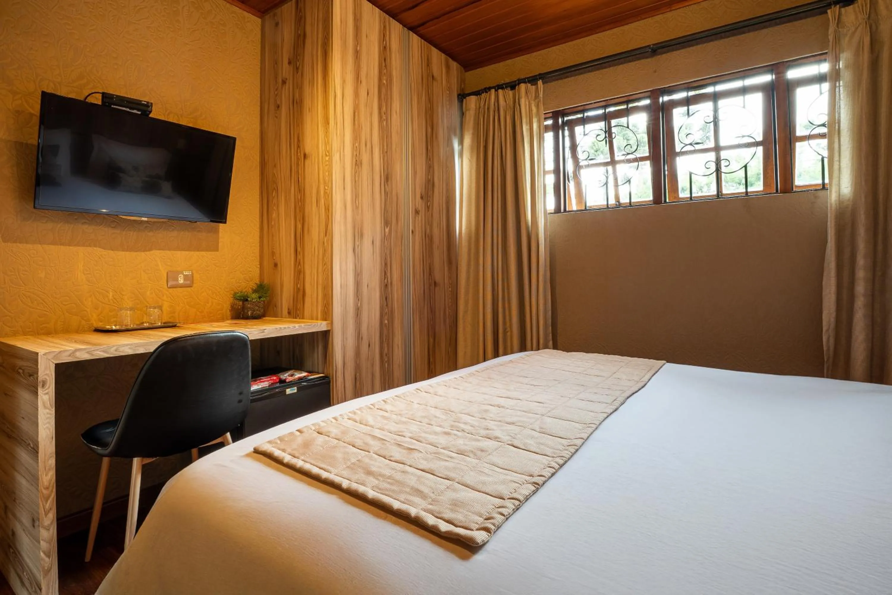 Photo of the whole room, Bed in Pousada Apple House Campos do Jordao