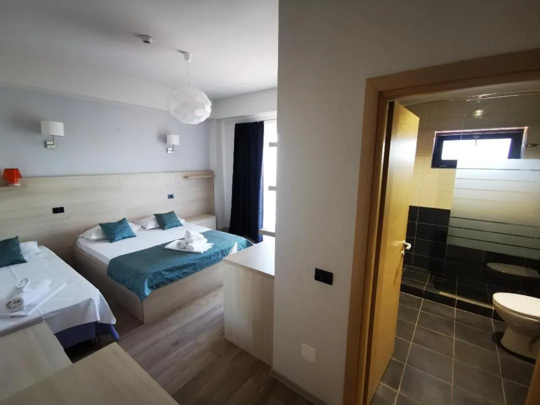 Bed in Kharisma Hotel