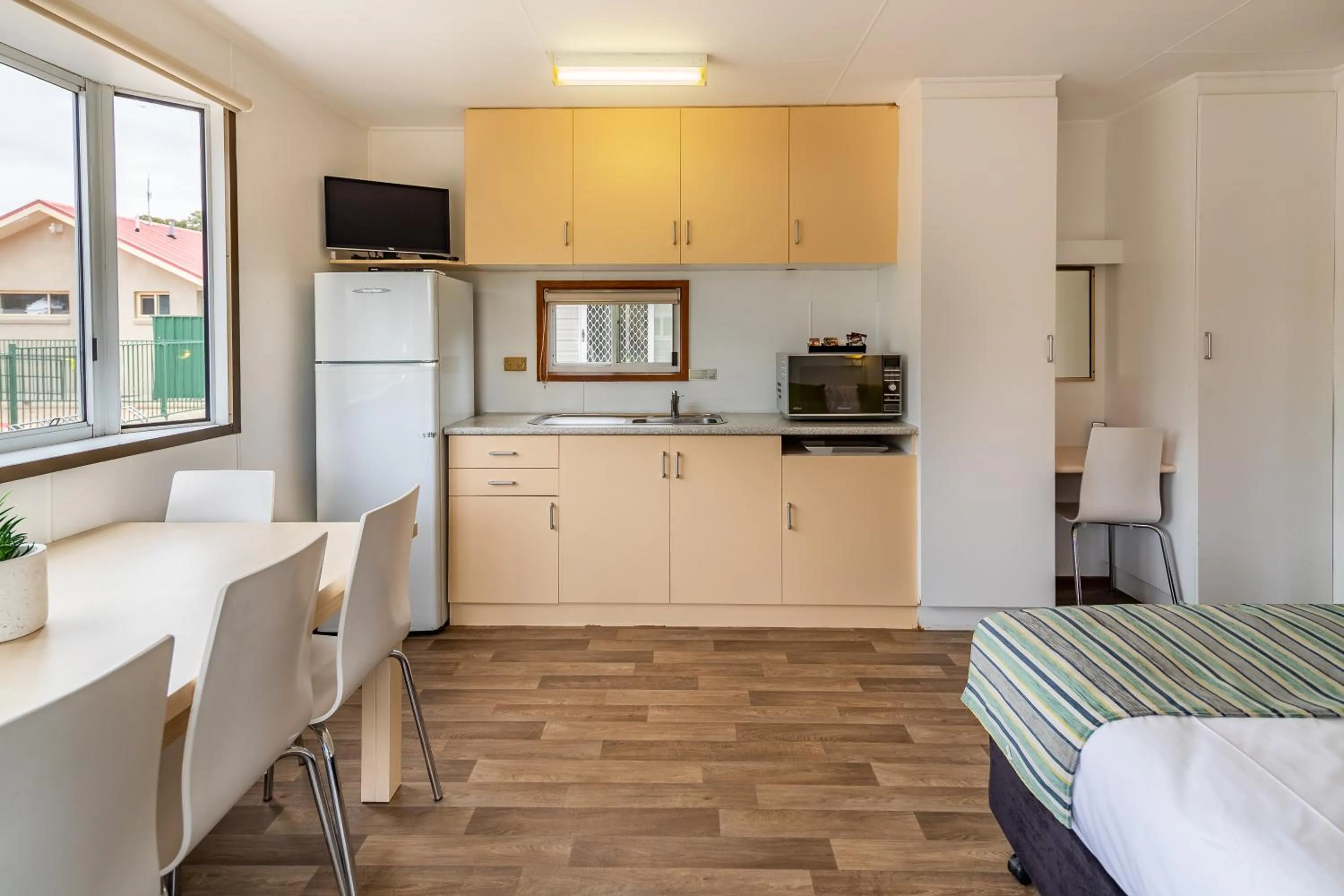 Dining area, Bed in NRMA Broulee Holiday park